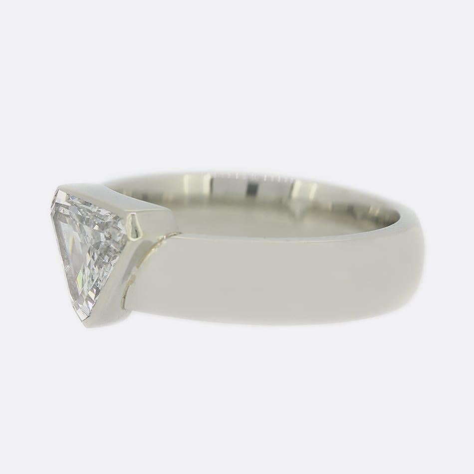 This is a single stone diamond engagement ring. The focal point of this ring is a shield cut diamond which has been rubover set in a platinum band.

Condition: Used (Very Good)
Weight: 10.6 grams
Size: O
Band Width: 5.0mm
Central Diamond Details: