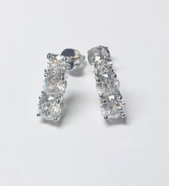 0.75 Carat Three-Stone Diamond Round Cut 18 Karat White Gold Drop Stud Earrings