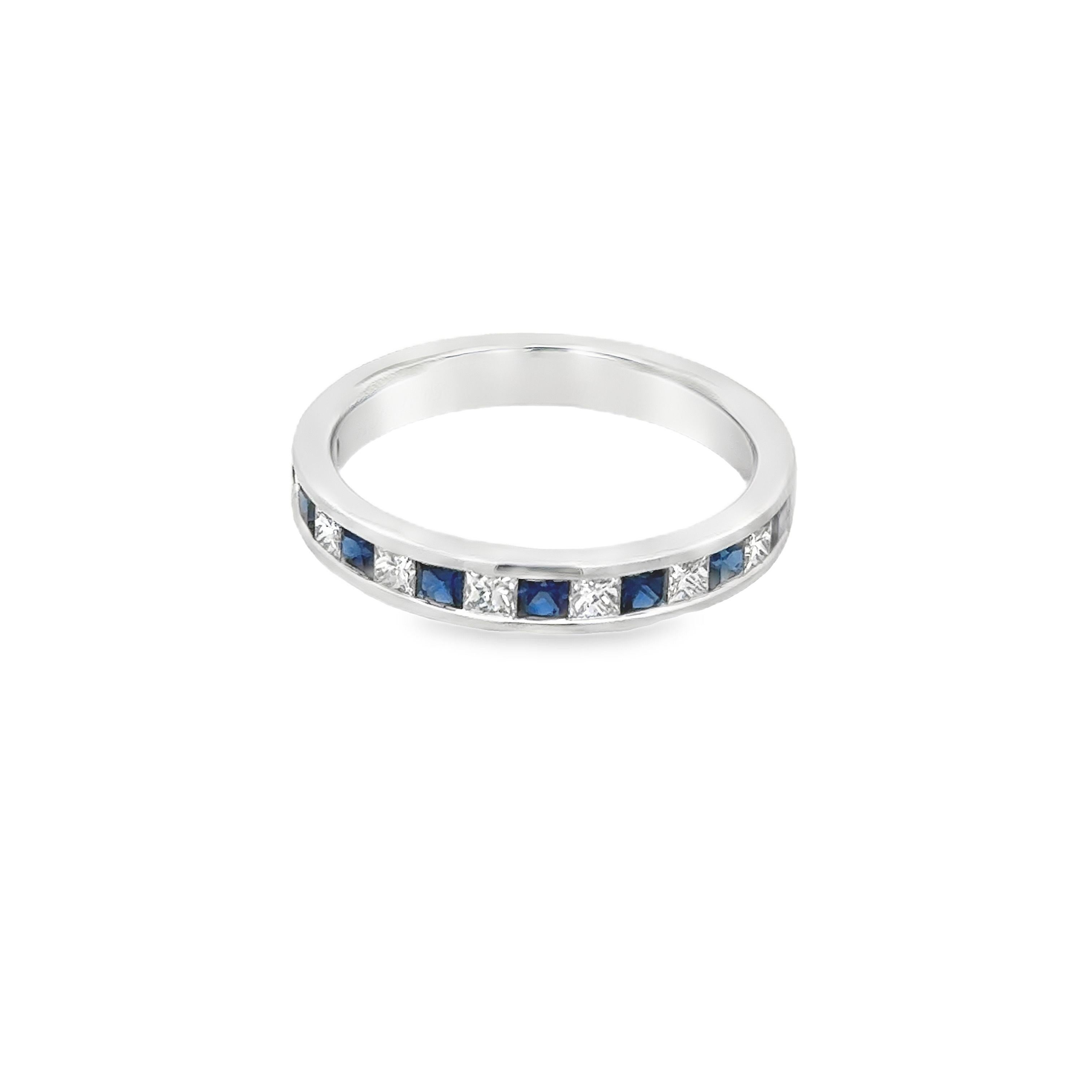 A chic semi-eternity wedding band ring, featuring eight princess cut sapphires weighing 0.41 carat total and seven princess cut diamonds weighing 0.34 carat total, channel-set in an alternating fashion. Finely made with 18K white gold. Size 6.5 US,