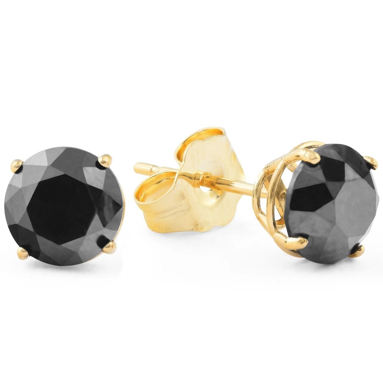 Make a daring statement with these spectacular diamond solitaire earrings. Crafted in 14K yellow gold, each earring showcases an alluring 4.2 mm mm natural round black diamond of in a four-prong setting. Impressive with 0.75 carat total weight of