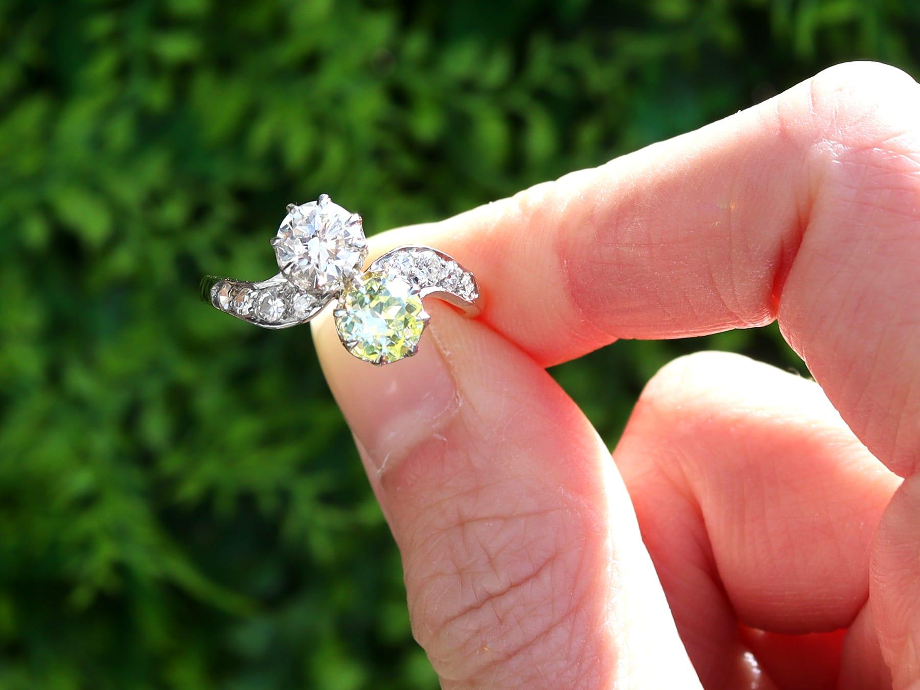 This fine and impressive antique twist ring has been crafted in 18k yellow gold with a platinum setting.

The pierced decorated twist design is ornamented with a claw set 0.75ct transitional modern brilliant round yellow diamond and a 0.77ct