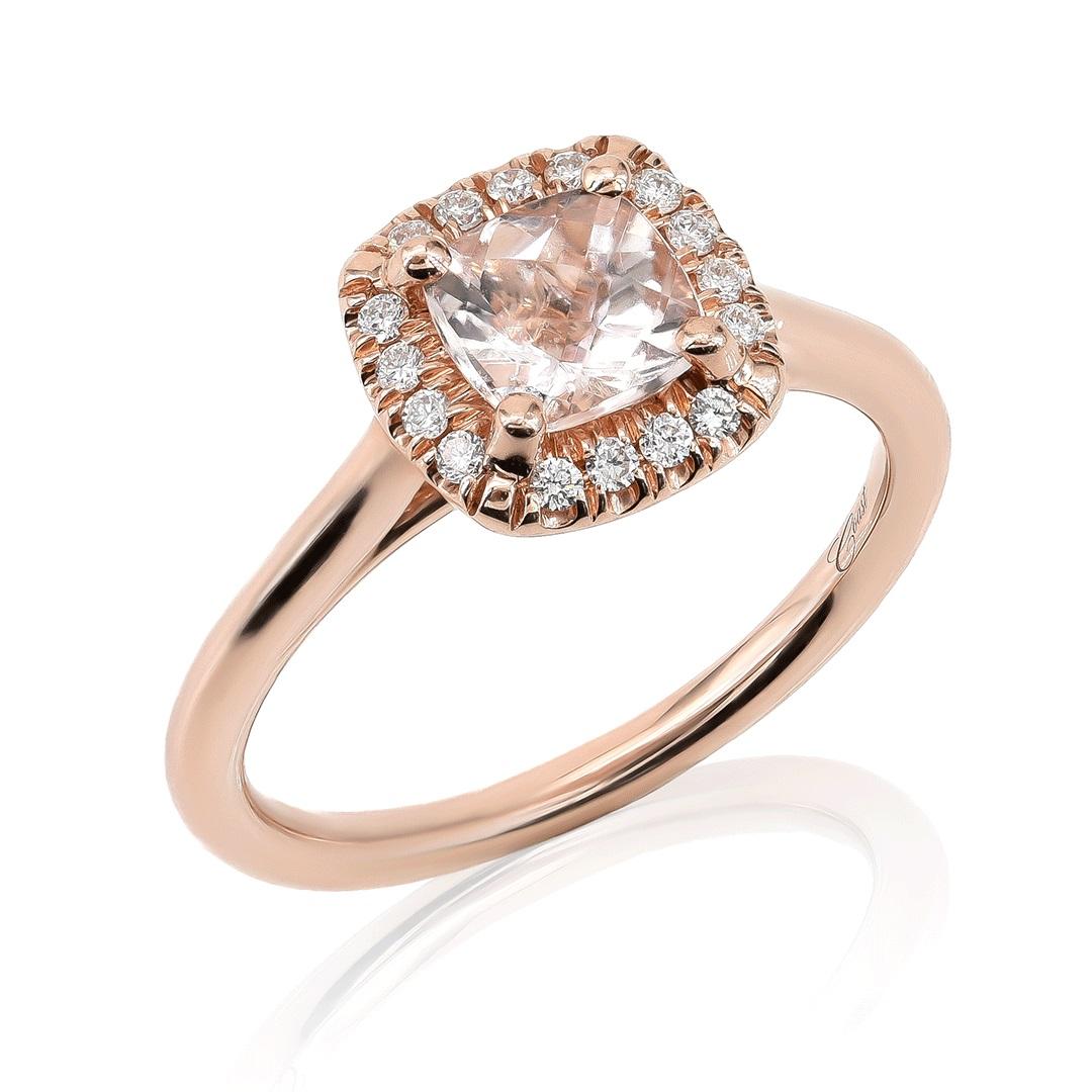 This 14K rose gold ring features a 0.75 carat cushion-cut natural Morganite gemstone complemented by 0.12 carats of diamonds. The Morganite's soft pink hue pairs beautifully with the warm tone of rose gold, while the surrounding diamonds add a touch