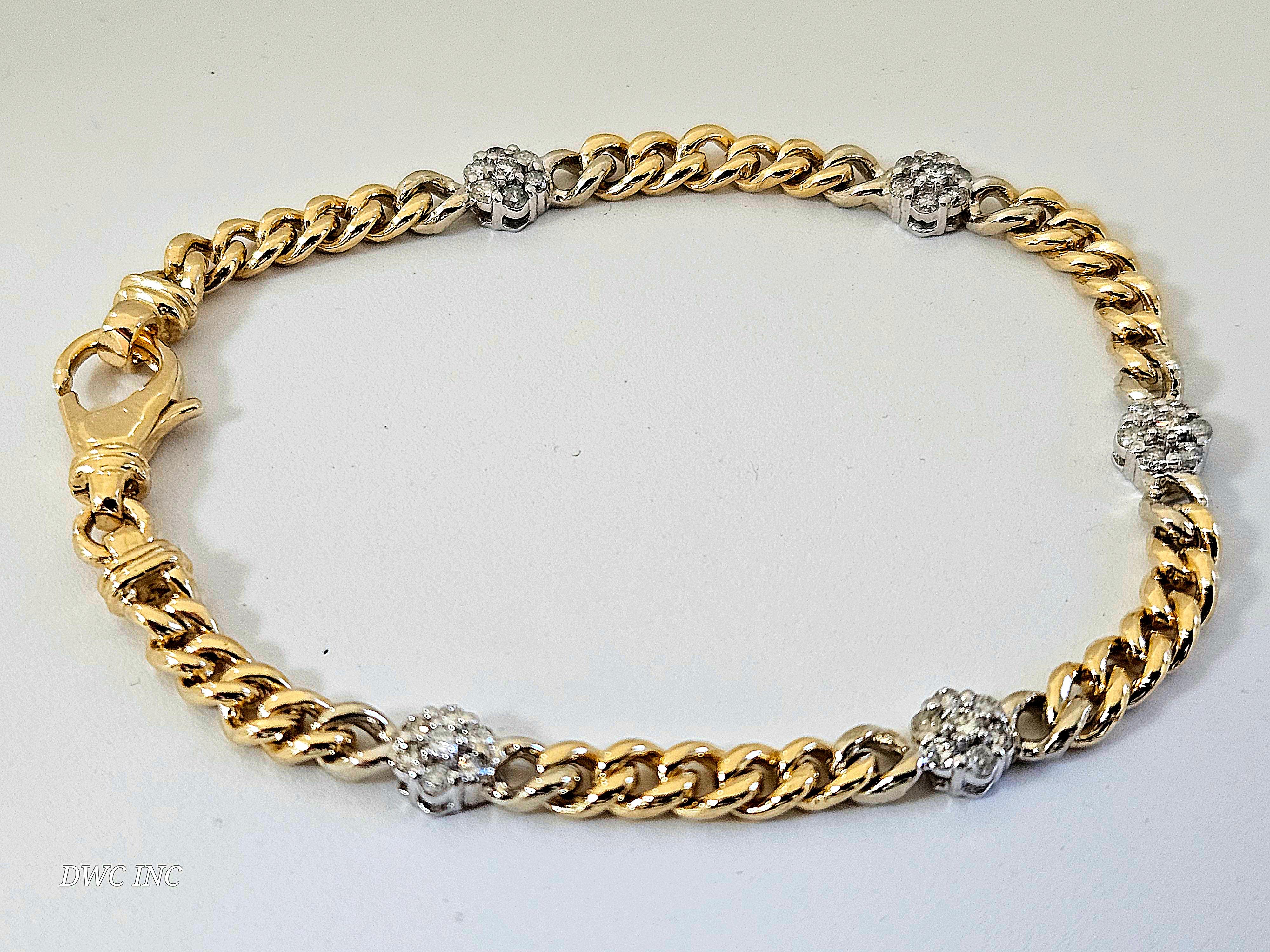 0.75 ctw Natural Diamond Cuban Bracelet Yellow and White Gold 14K 7 inch
Natural Round Diamonds, Very shiny, secure box togue clasp.
Average color I-I, 35pcs  5.7 mm width. 12.28 grams.