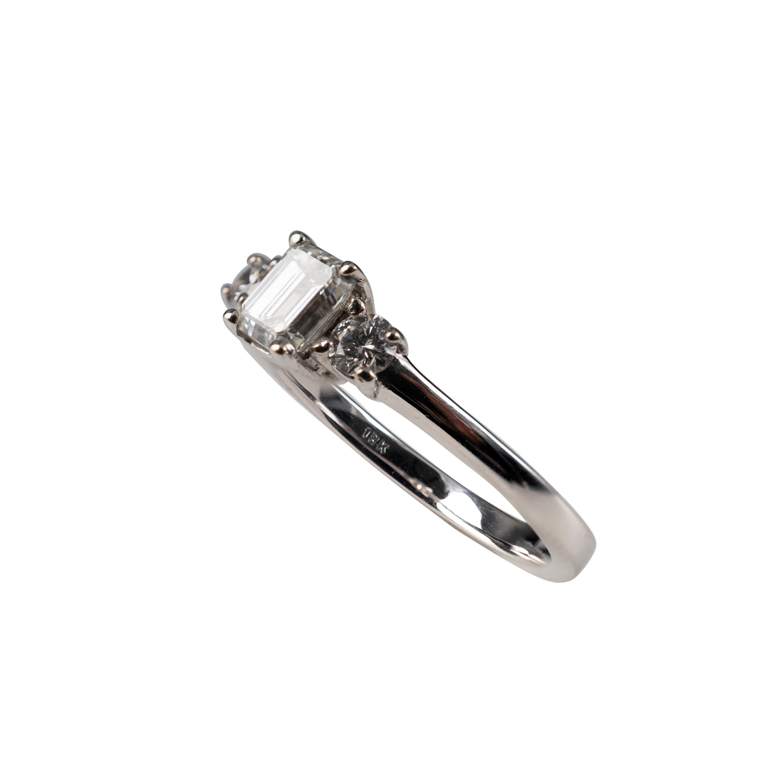 Women's 0.75 Carat Emerald Cut & Round Cut Diamond Ring 18 Karat White Gold Hallmarked For Sale