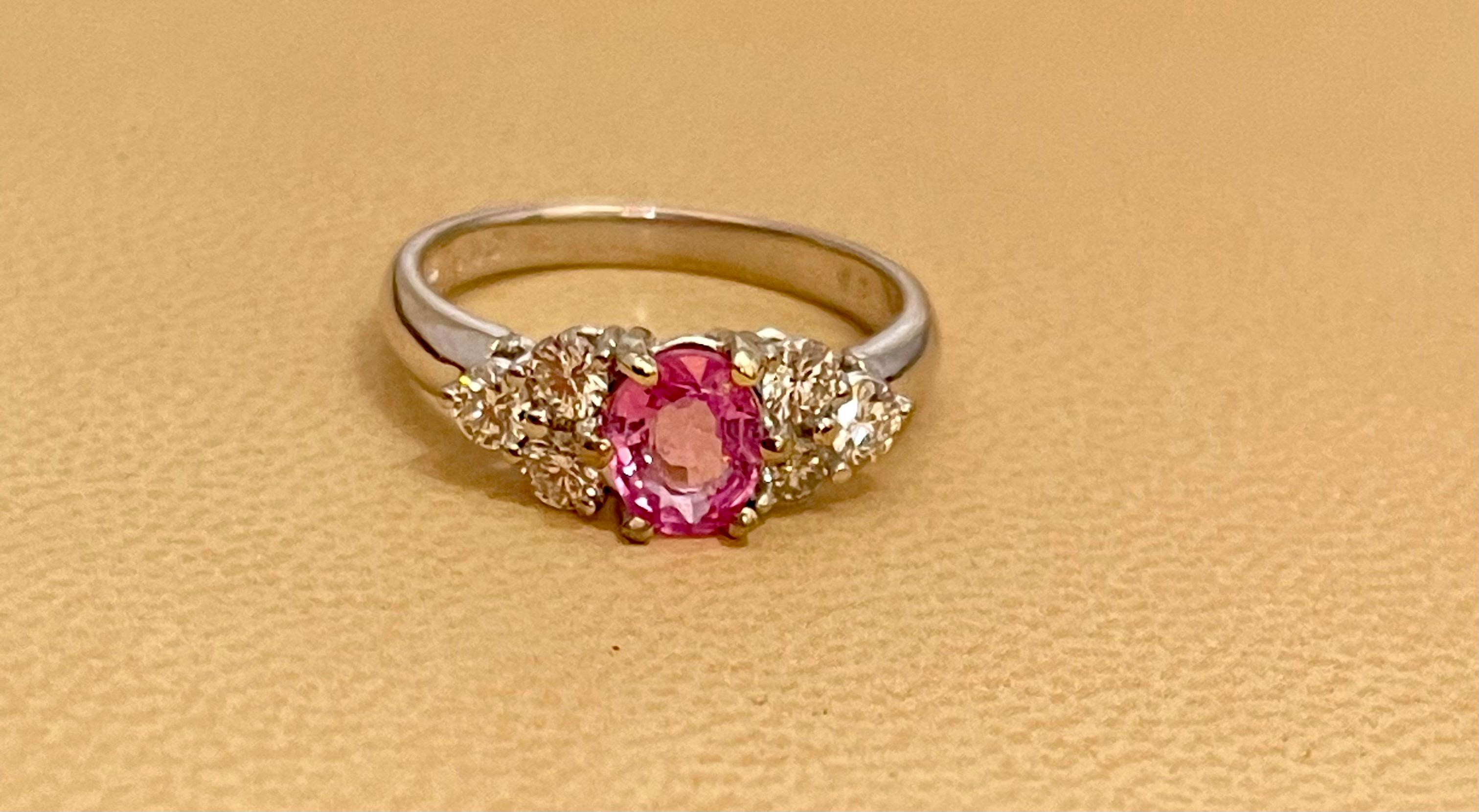 A classic, Ring 
0.75 Ct Oval Pink Sapphire & 0.50  Ct Diamond Ring in 18 Karat White gold.
Natural Pink Sapphire in Oval   shape , Pretty color, luster is amazing and  have very little inclusions .
There are brilliant cut diamonds around the pink