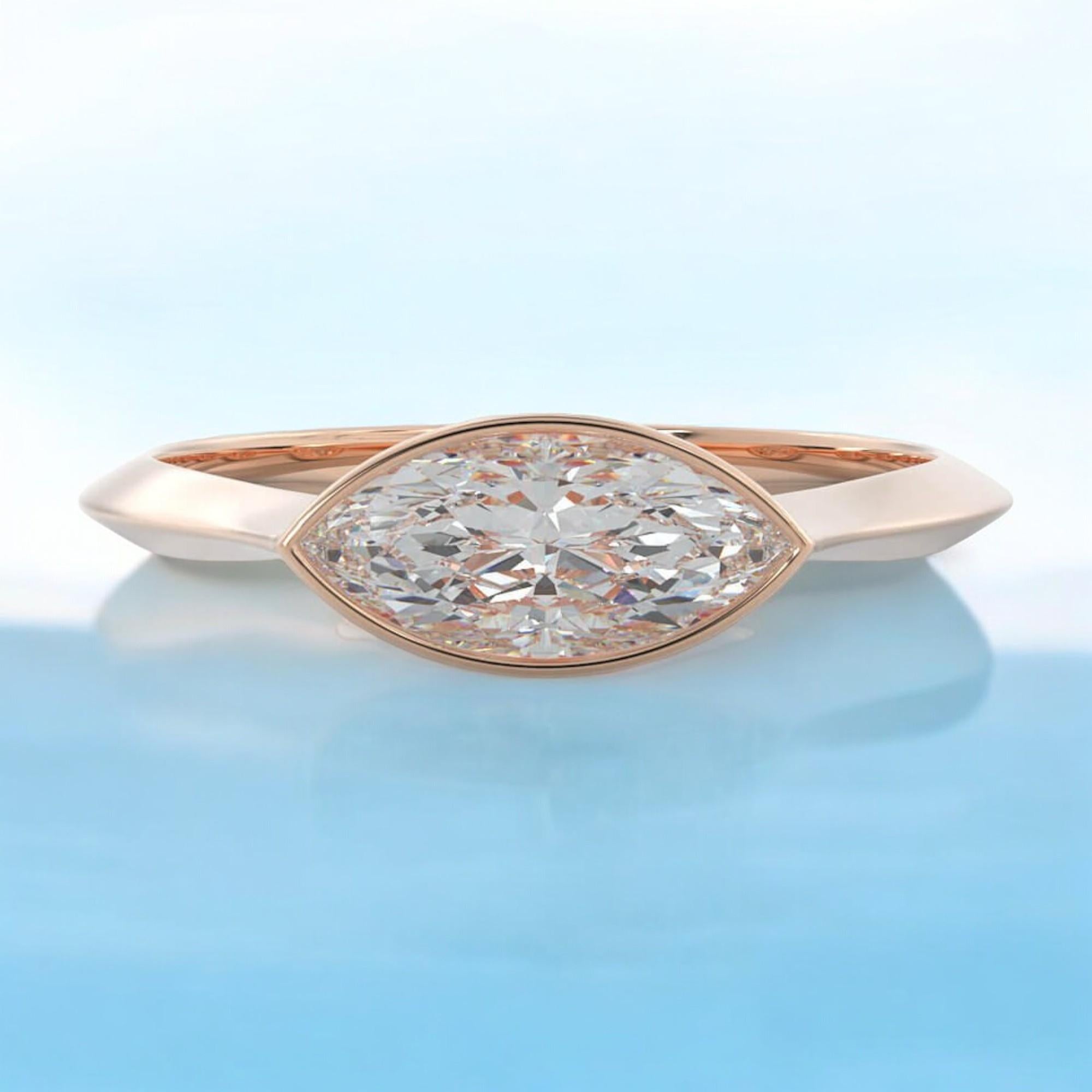This elegant engagement ring showcases a 0.75-carat marquise diamond in a classic rose gold solitaire setting. GIA-certified as F/VS1, the diamond ensures top-tier quality and authenticity. Available in size 6, the ring can be customized to your