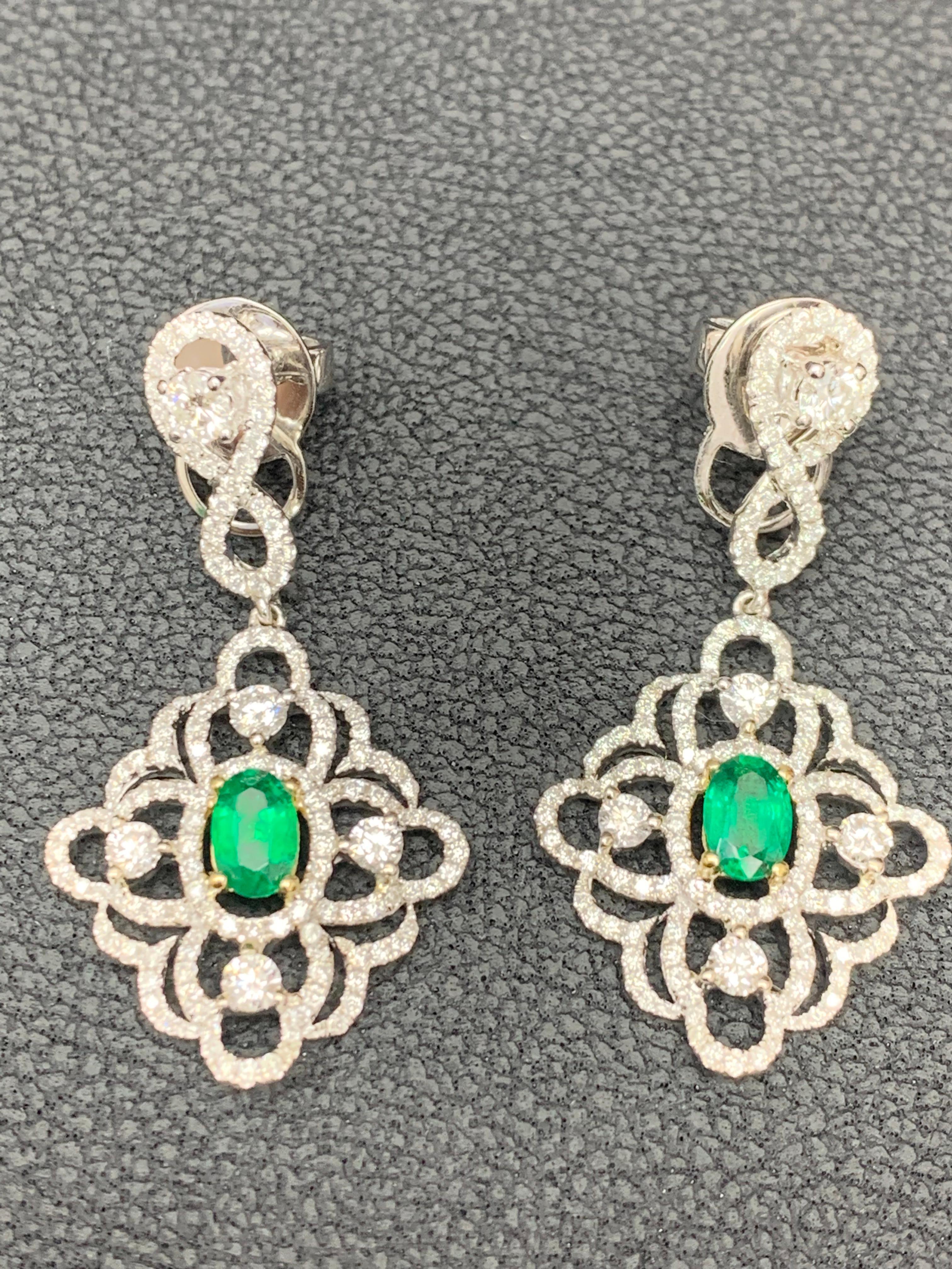 Contemporary 0.75 Oval Cut Emerald and Open-Work Diamond Chandelier Earrings in 18K Mix Gold For Sale