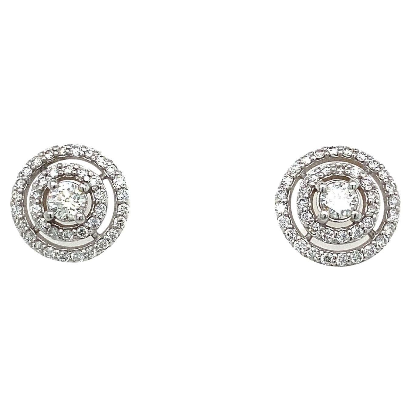 18ct White Gold 2 Row Pave Set Diamond Earrings Set With 0.75ct Of Round Diamond

These elegant 18ct White Gold earrings feature 0.75ct of round Diamonds. The earrings are set in a 2 row pave set Diamond halo setting, are the perfect choice for a