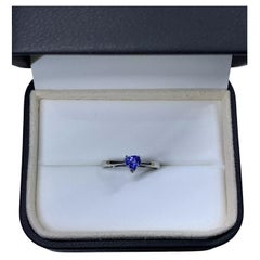 0.75ct Blue sapphire heart solitaire engagement ring in platinum.