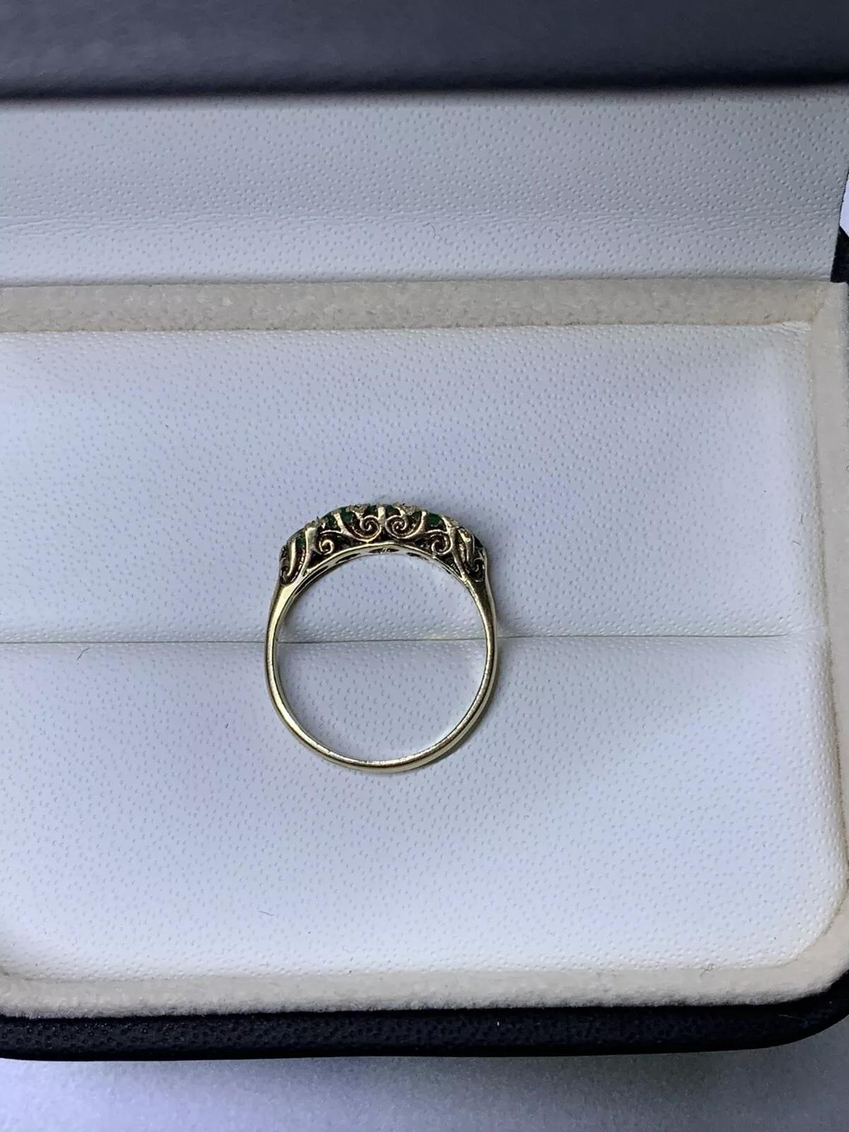 0.75ct Colombian green emerald eternity engagement ring 9ct yellow gold.

Colombian green vivid emerald eternity ring in 9k rose pink gold antique style.

Colombian gemstone round shaped natural untreated.

Hallmarked

The ring can be resized

Box