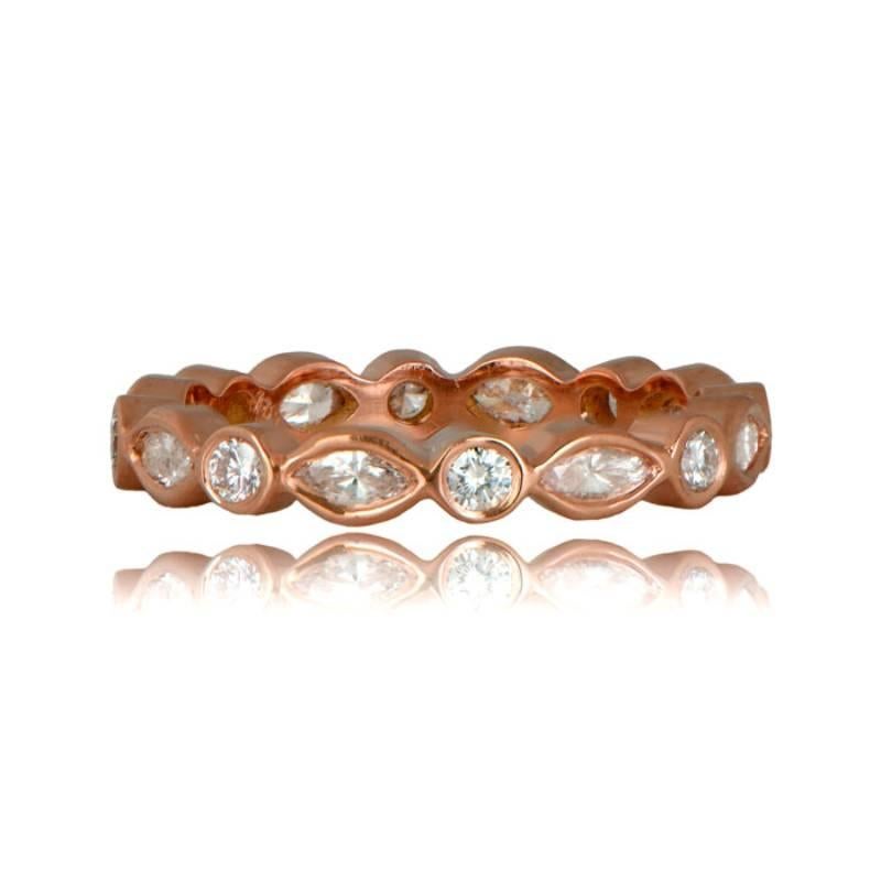 This exquisitely handcrafted band combines round and marquise-cut diamonds, each bezel-set in an alternating pattern around the 18k rose gold band. With a total approximate diamond weight of 0.75 carats for size 6.5, this band boasts a width of