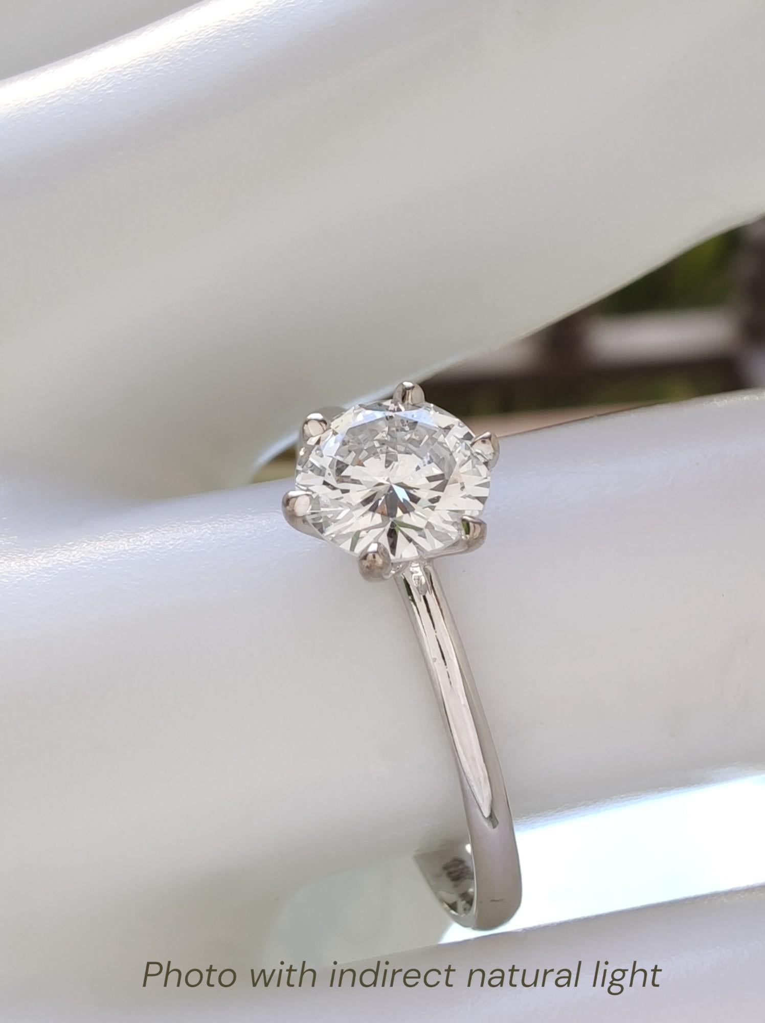 Experience timeless elegance with this luxurious 18K white gold solitaire engagement ring, meticulously crafted to the highest standards of fine jewelry. Featuring a breathtaking 0.75-carat natural round brilliant diamond ), this ring showcases the