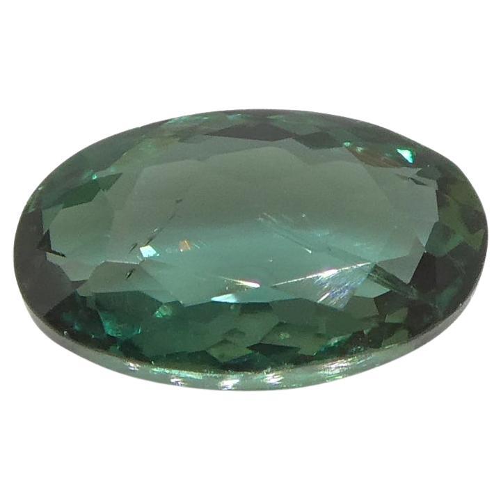 The GIA report reads as follows:

GIA Report Number: 6227341869
Shape: Oval
Cutting Style:
Cutting Style: Crown: Brilliant Cut
Cutting Style: Pavilion: Modified Brilliant Cut
Transparency: Transparent
Color: Blue-Green changing to Purple

