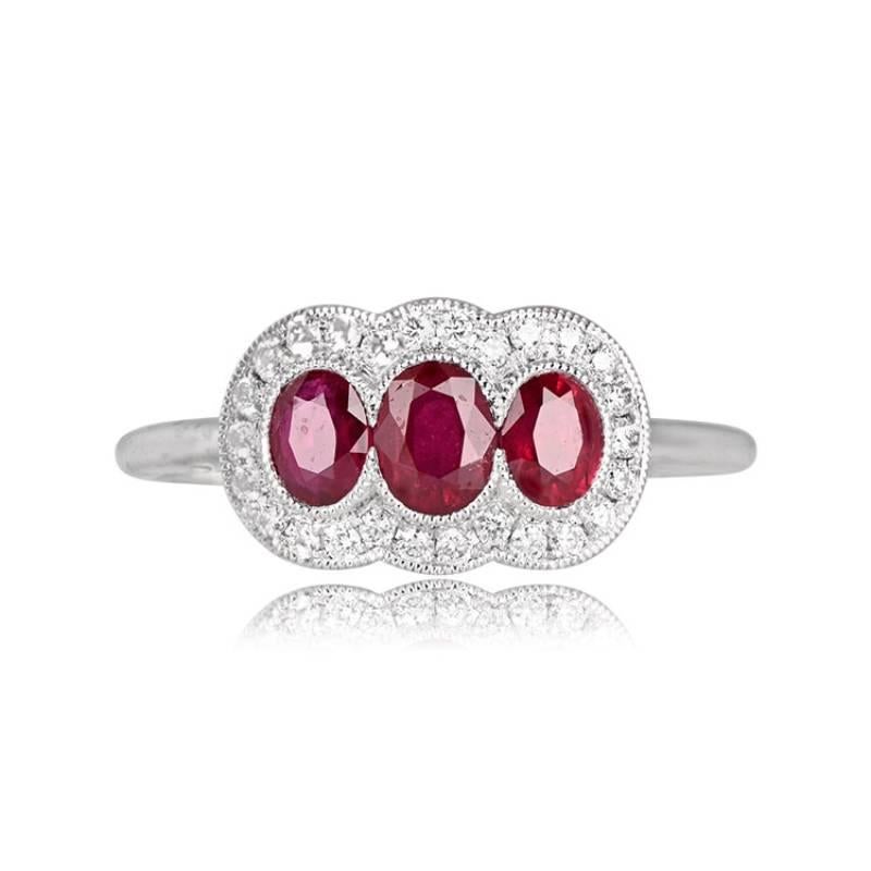 A platinum three-stone ring with east-west oriented oval cut rubies totaling 0.75 carats. The rubies are bezel-set and surrounded by a halo of round brilliant-cut diamonds.


Ring Size: 6.5 US, Resizable
Metal: Platinum
Stone: Diamond, Ruby
Stone