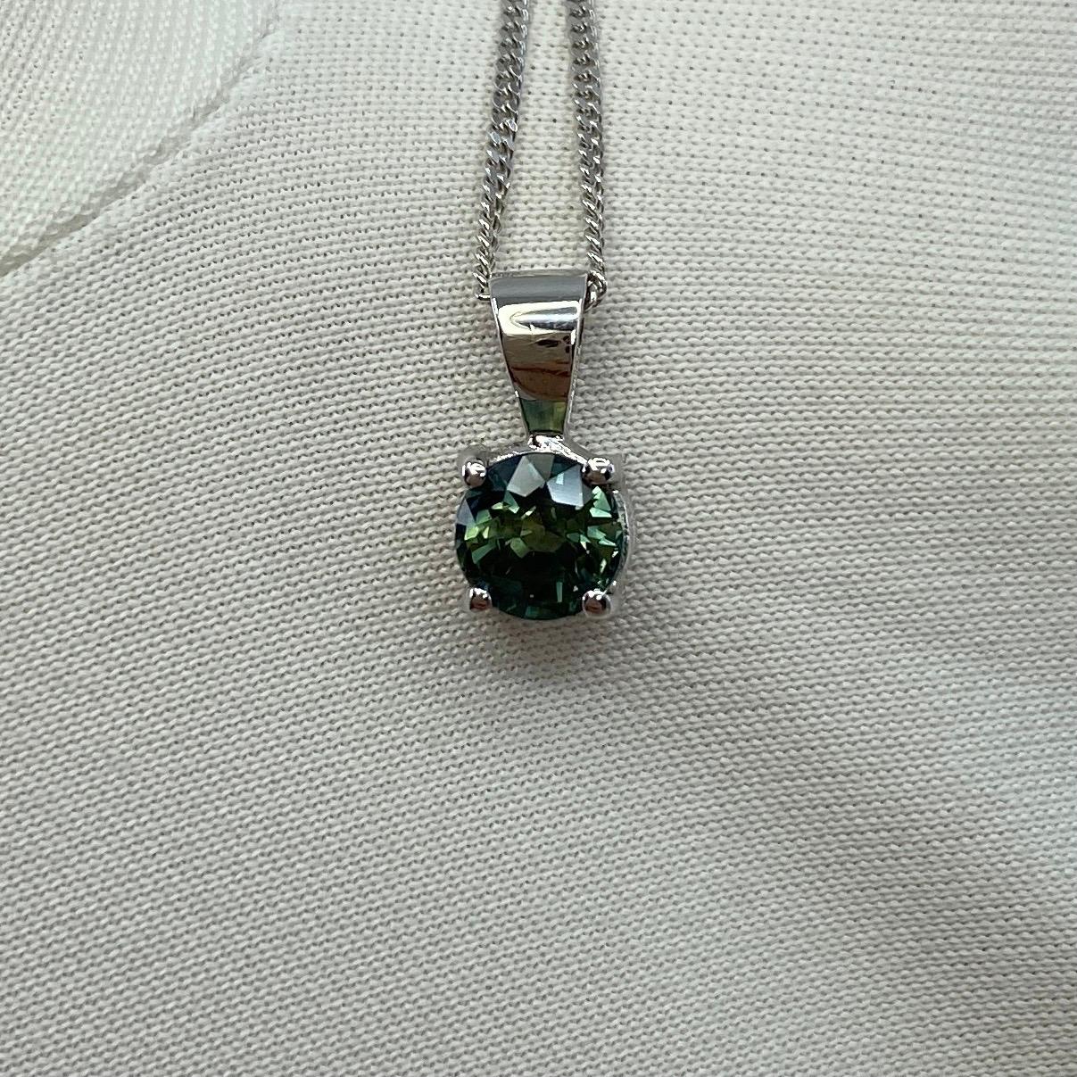 Untreated Parti Colour Blue Green Sapphire 18k White Gold Pendant Necklace.

0.75 Carat sapphire with a unique blue green-yellow colour and excellent clarity, very clean stone.
The sapphire also has an excellent round brilliant cut which shows lots
