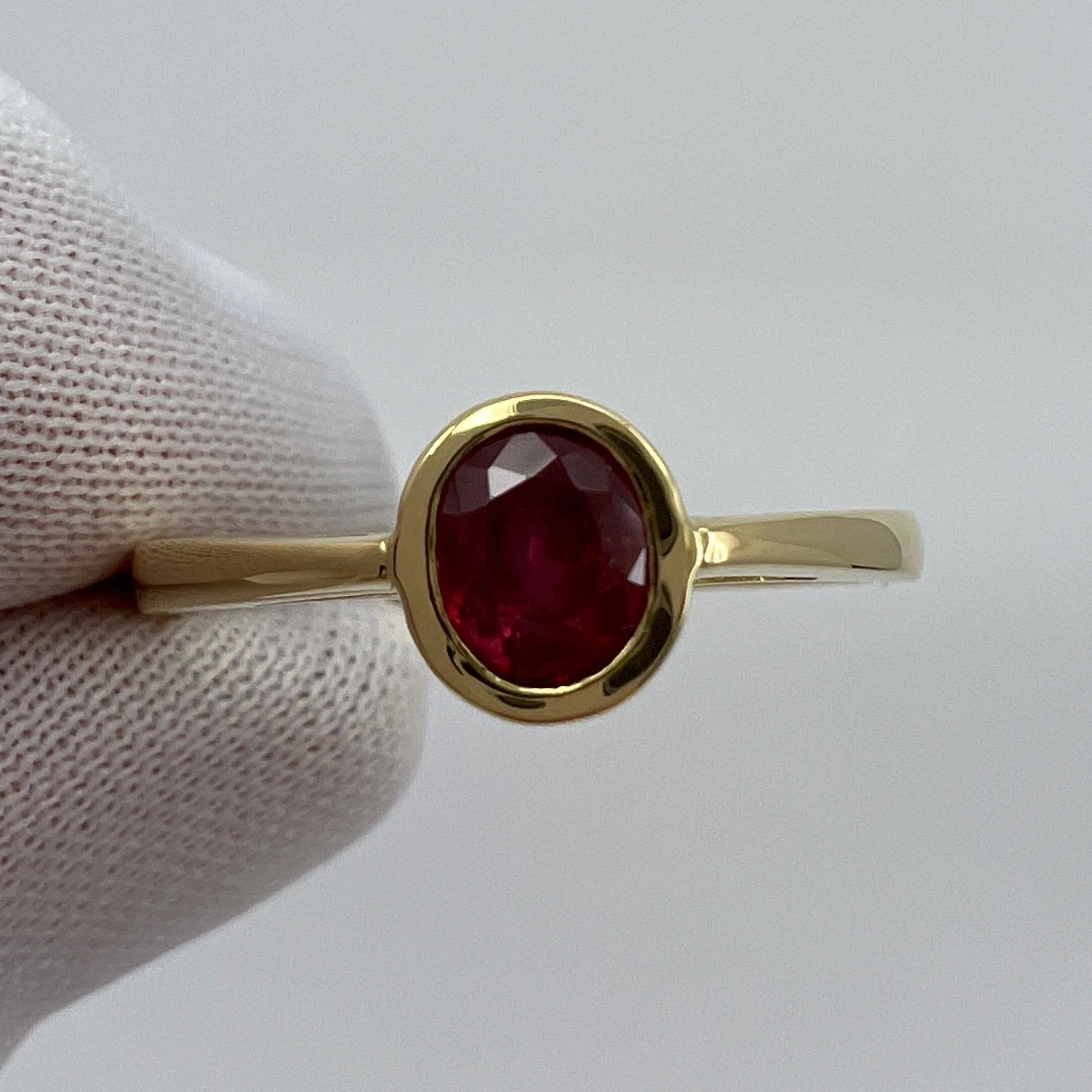 Fine Vivid Red Ruby 18 Karat Yellow Gold Solitaire Ring.

Stunning 0.75 carat ruby with a fine vivid red colour and excellent oval cut. Also has very good clarity with only some small natural inclusions visible when looking closely.

The ruby is set