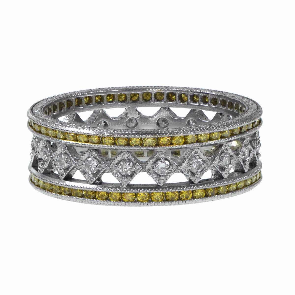 This exquisite platinum wedding band features a central row of approximately 0.30 carats combined with white diamonds with H color and VS1 clarity. On each side, channel-set yellow diamonds enhance the design, contributing to a total yellow diamond