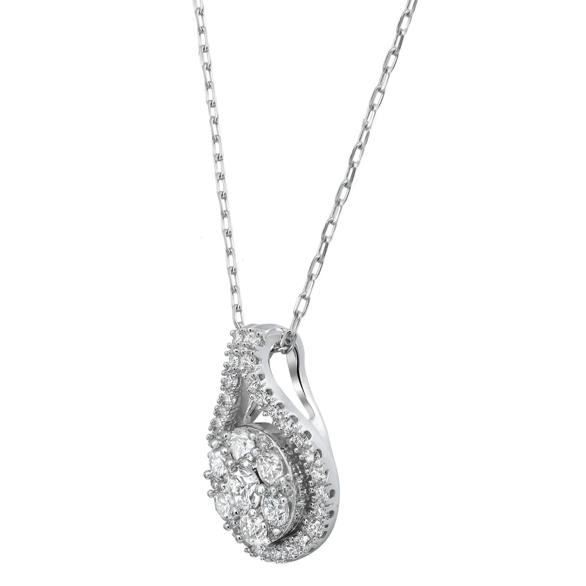 This ladies stunning diamond pendant adds sheer beauty and brilliance with striking round cut diamonds that are encircled excellently by a fine series of small shimmering round shaped stones aligned in a classic prong setting. Total diamond carat
