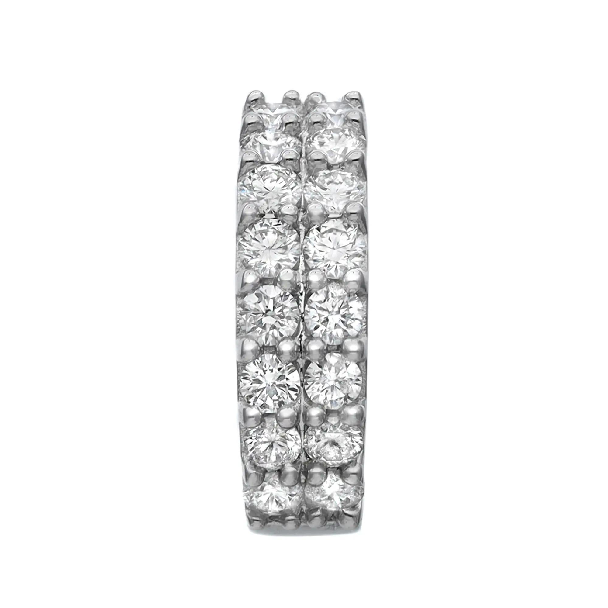 These glamorous diamond huggie earrings feature pave set round brilliant cut diamonds weighing 0.75 carat. Encrusted in lustrous 14K white gold. Diamond quality: color G-H and clarity VS-SI. Earring size: 15mm. Width: 4.8mm. Total weight: 6.38