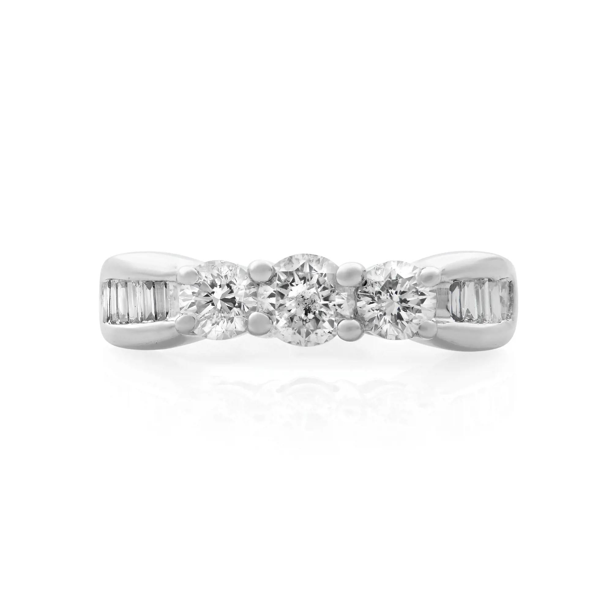 Classic and elegant diamond wedding band ring rendered in highly polished 14K white gold. This ring features perfectly matched 3 prong set sparkling round brilliant cut diamonds in the center with baguette cut diamonds on both sides. Total diamond