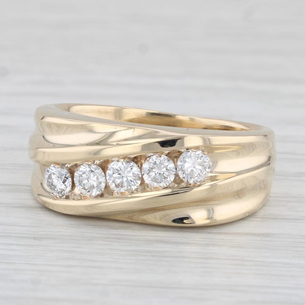 Gemstone Information:
- Natural Diamonds -
Total Carats - 0.75ctw
Cut - Round Brilliant 
Color - F - G
Clarity - SI1 - SI2

Metal: 14k Yellow Gold
Weight: 8.9 Grams 
Stamps: 14k
Face Height: 9.5 mm 
Rise Above Finger: 4.9 mm
Band / Shank Width: 4