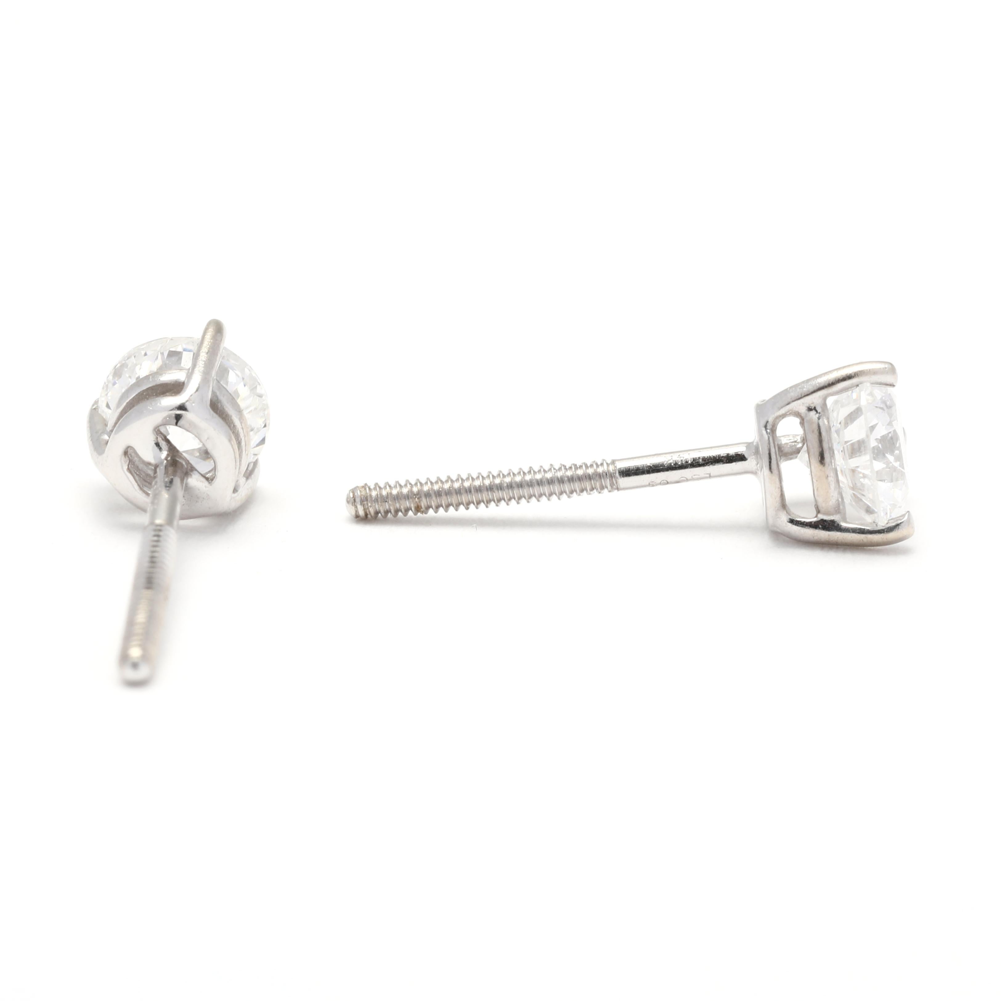 Each earring features a round-cut diamond with a total carat weight of 0.75ctw. The diamonds are hand-selected for their exceptional clarity and sparkle, and they are securely set in a classic four-prong setting. The 14K white gold setting enhances
