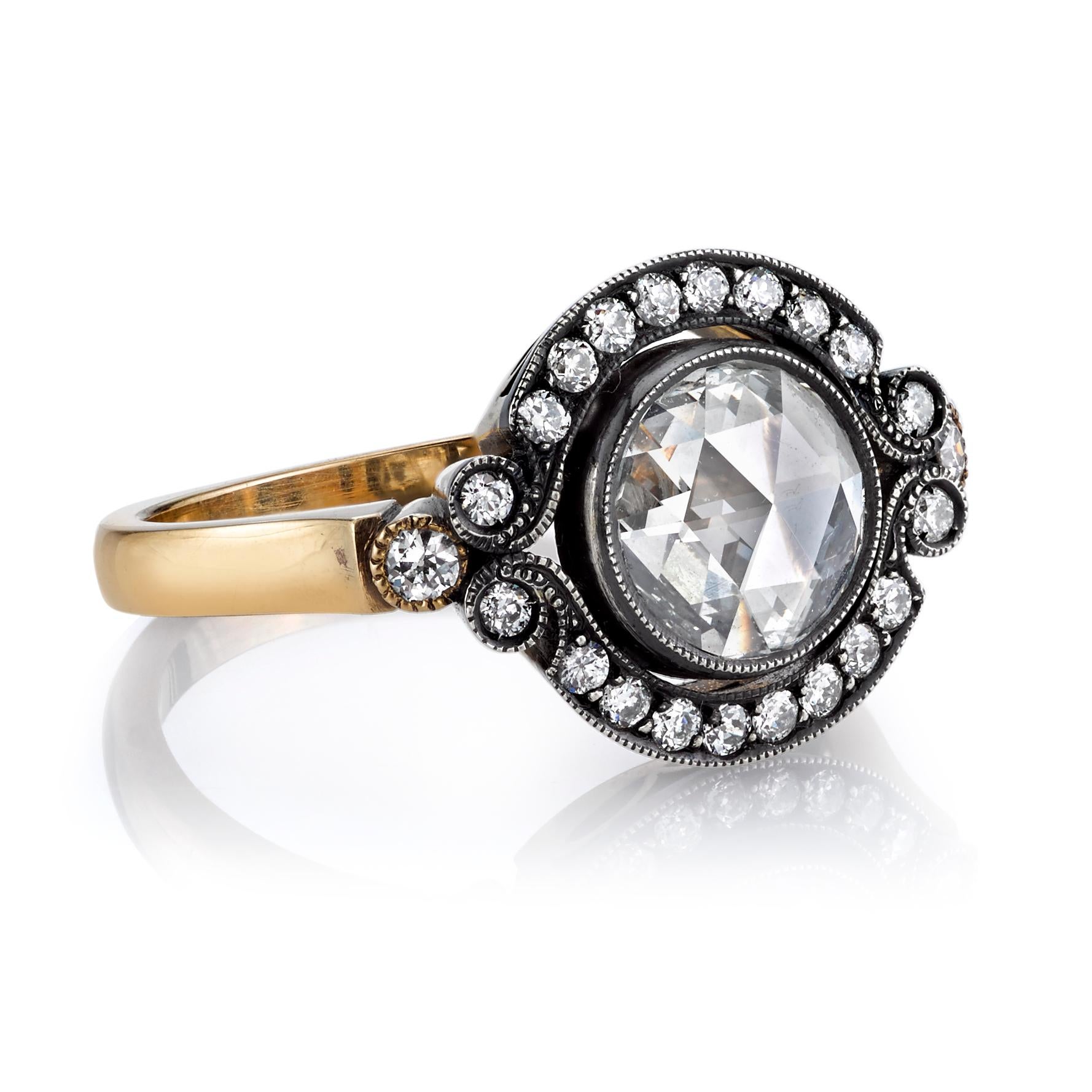 0.75ct G/SI1 EGL certified Rose cut diamond set in a handcrafted 18K yellow gold mounting. The center stone along with 0.29ctw old European cut accent diamonds are set in an oxidized silver head with a millgrained edge.

Ring is currently a size 6