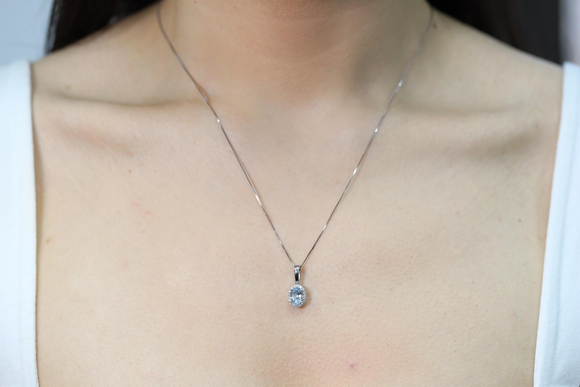 Decorate yourself in elegance with this Pendant is crafted from 10-karat White Gold by Gin & Grace Pendant. This Pendant is made up of 5X7 Oval-Cut Prong setting Genuine Aquamarine (1 Pcs) 0.76 Carat and Round-Cut Prong setting Natural White Diamond