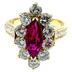 0.76 Carat Marquise Ruby and Round Brilliant Diamond Yellow Gold Ring