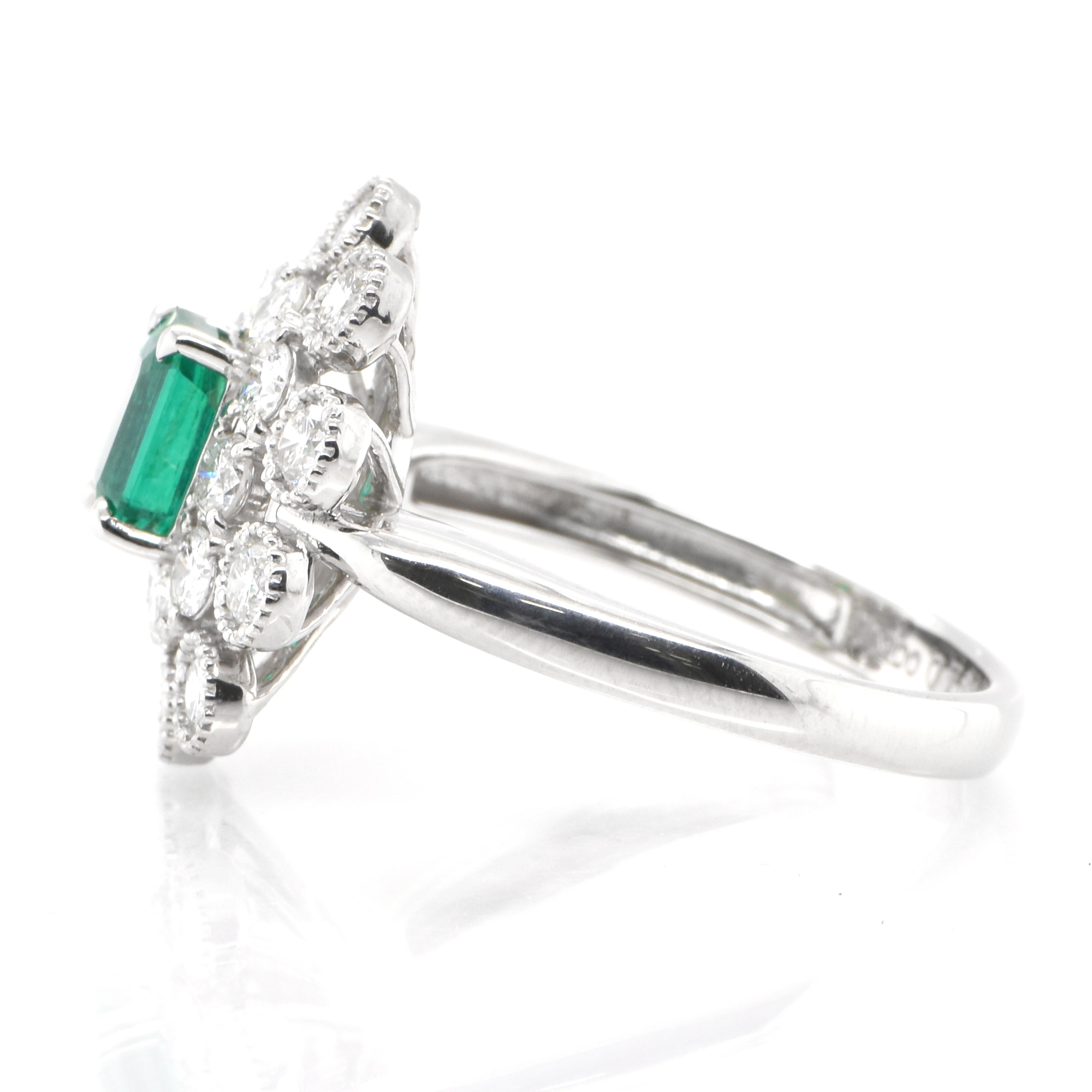 Emerald Cut 0.76 Carat Natural Emerald and Diamond Double Halo Ring Set in Platinum For Sale