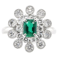 0.76 Carat Natural Emerald and Diamond Double Halo Ring Set in Platinum