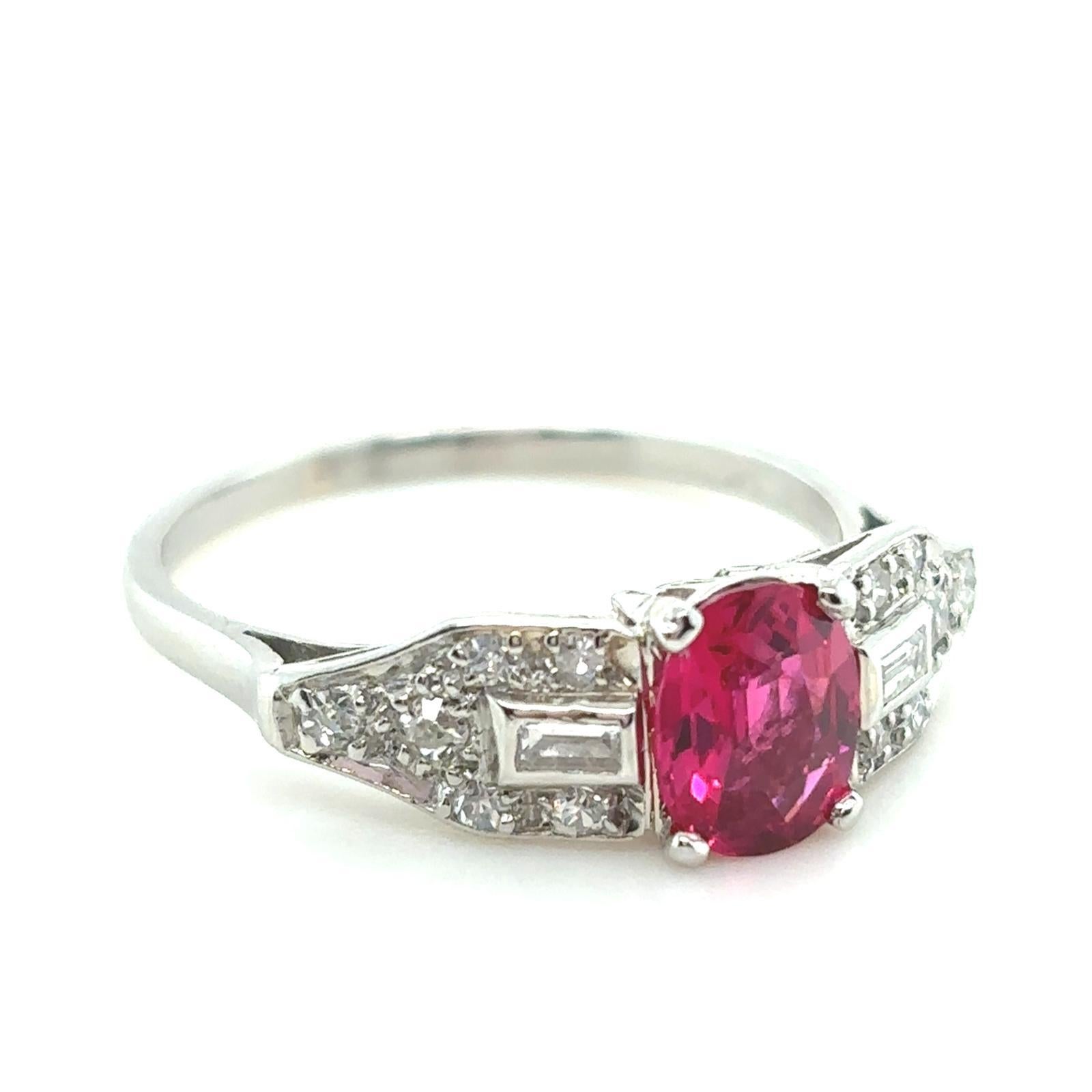 A 0.76 carat red spinal and diamond platinum ring

This beautiful ring is handcrafted in platinum. Claw set to its centre with an oval cut red spinel of 0.76 carats. The striking stone is a vivid lively red, of even and full colour.
 
The spinel is