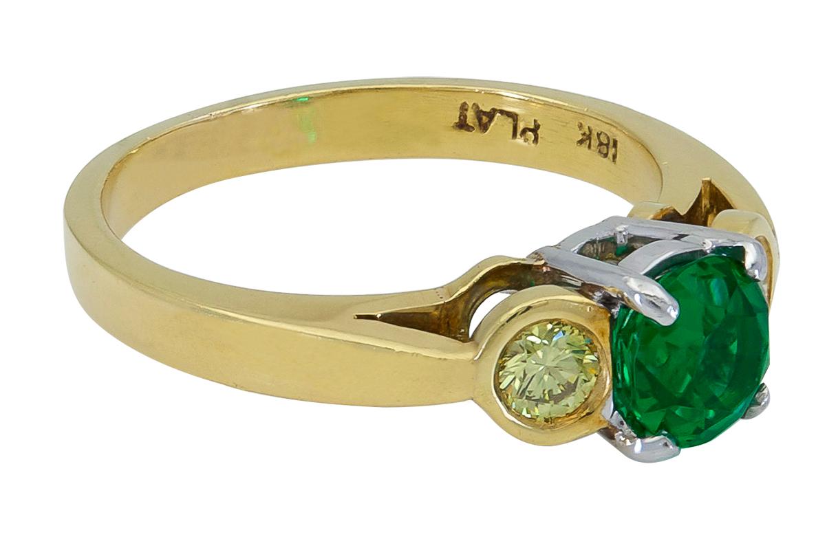 Contemporary 0.76 Carat Round Green Emerald and Yellow Diamond Three-Stone Engagement Ring For Sale