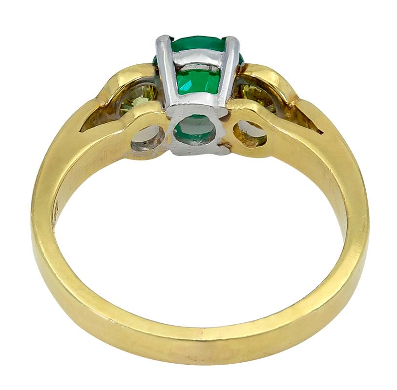 Round Cut 0.76 Carat Round Green Emerald and Yellow Diamond Three-Stone Engagement Ring For Sale