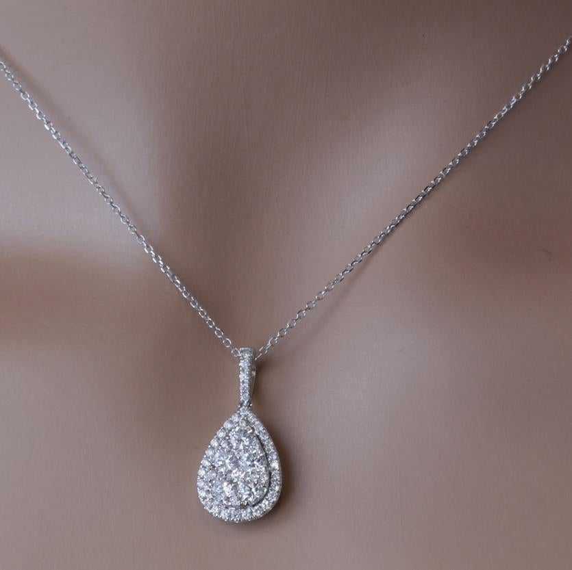 Elevate your elegance with our exquisite pendant, meticulously crafted to capture your heart. Nestled within this stunning piece are a multitude of intricately placed, natural, round diamonds, masterfully arranged to create the illusion of a grand
