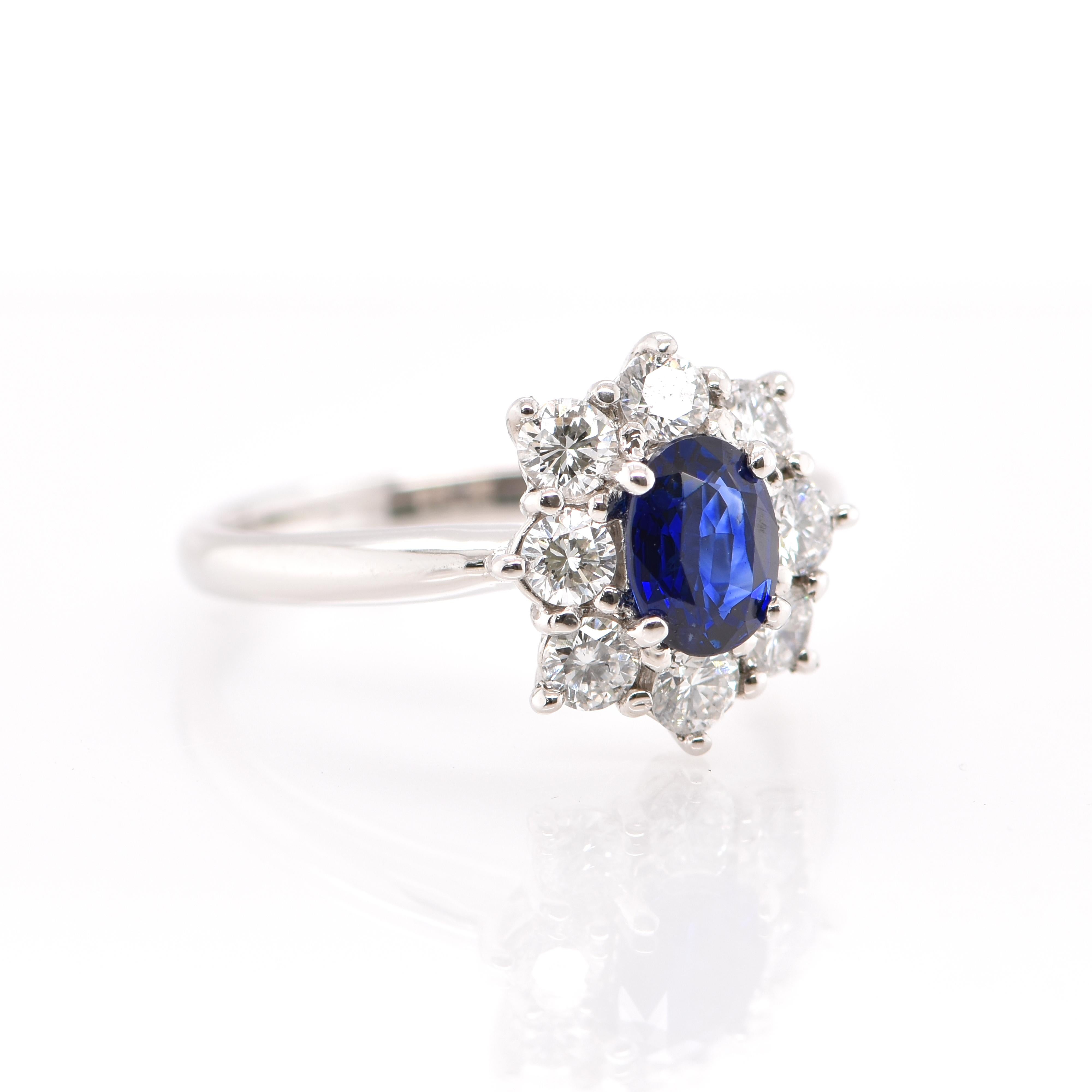 Modern 0.77 Carat Natural Sapphire and Diamond Halo Ring Set in Platinum For Sale