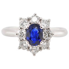 0.77 Carat Natural Sapphire and Diamond Halo Ring Set in Platinum