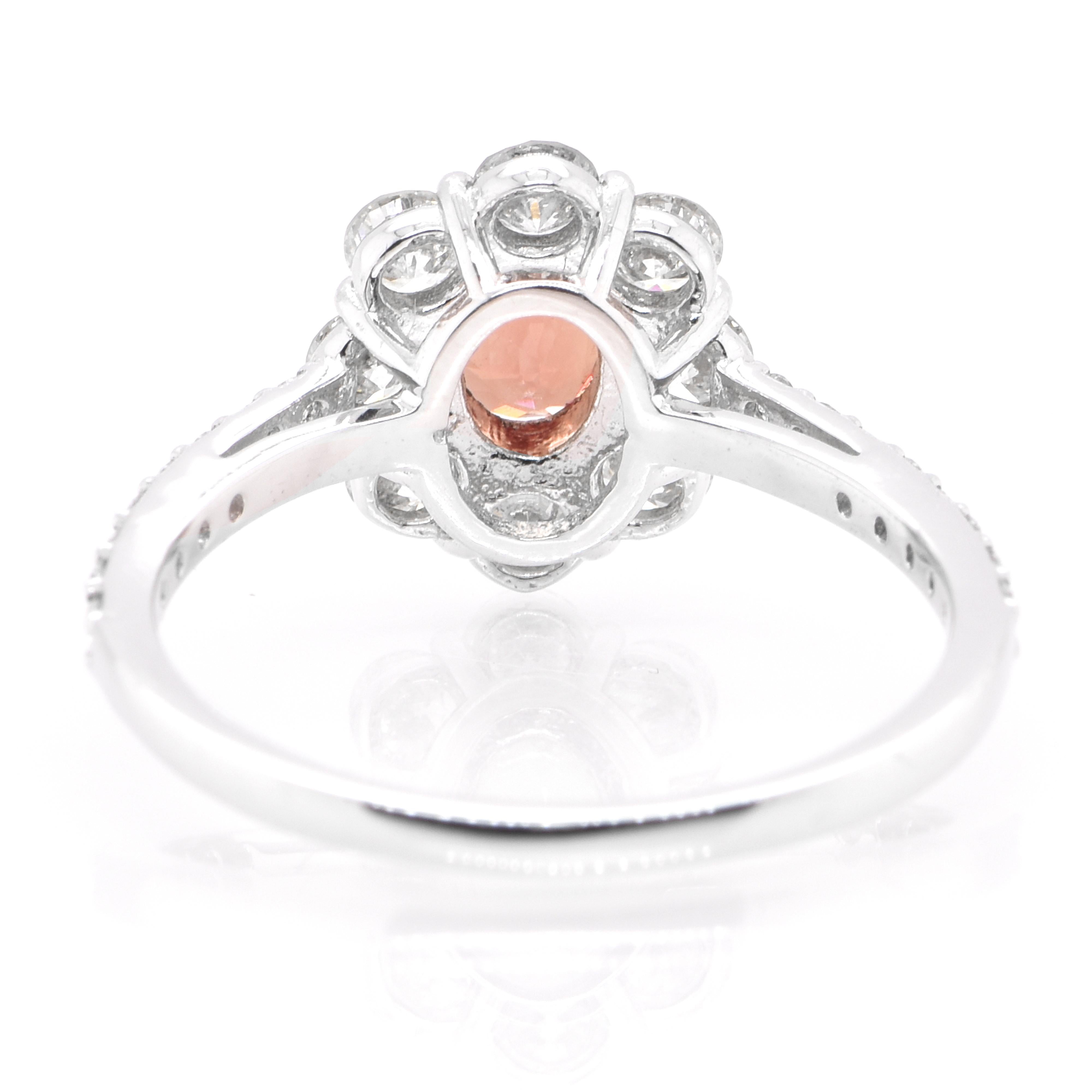 A beautiful ring featuring a 0.772 Carat, Natural Padparadscha Sapphire and 0.79 Carats of Diamond Accents set in Platinum. Sapphires have extraordinary durability - they excel in hardness as well as toughness and durability making them very popular