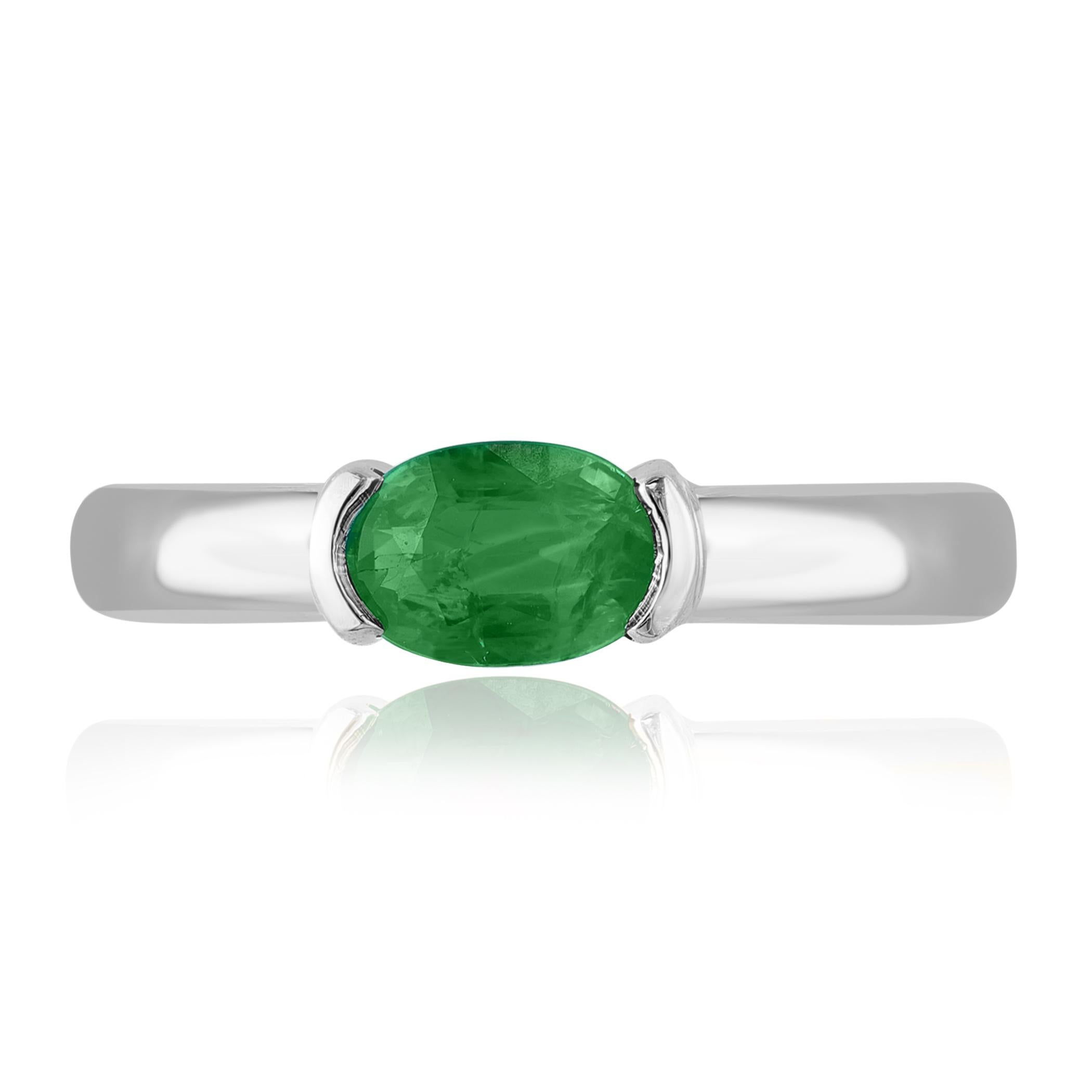 An elegant wedding band ring featuring an astonishing 0.77-carat oval cut emerald, set in a beautiful wide 14K white gold band. 

Style is available in different price ranges. Prices are based on your selection. Don't hesitate to get in touch with