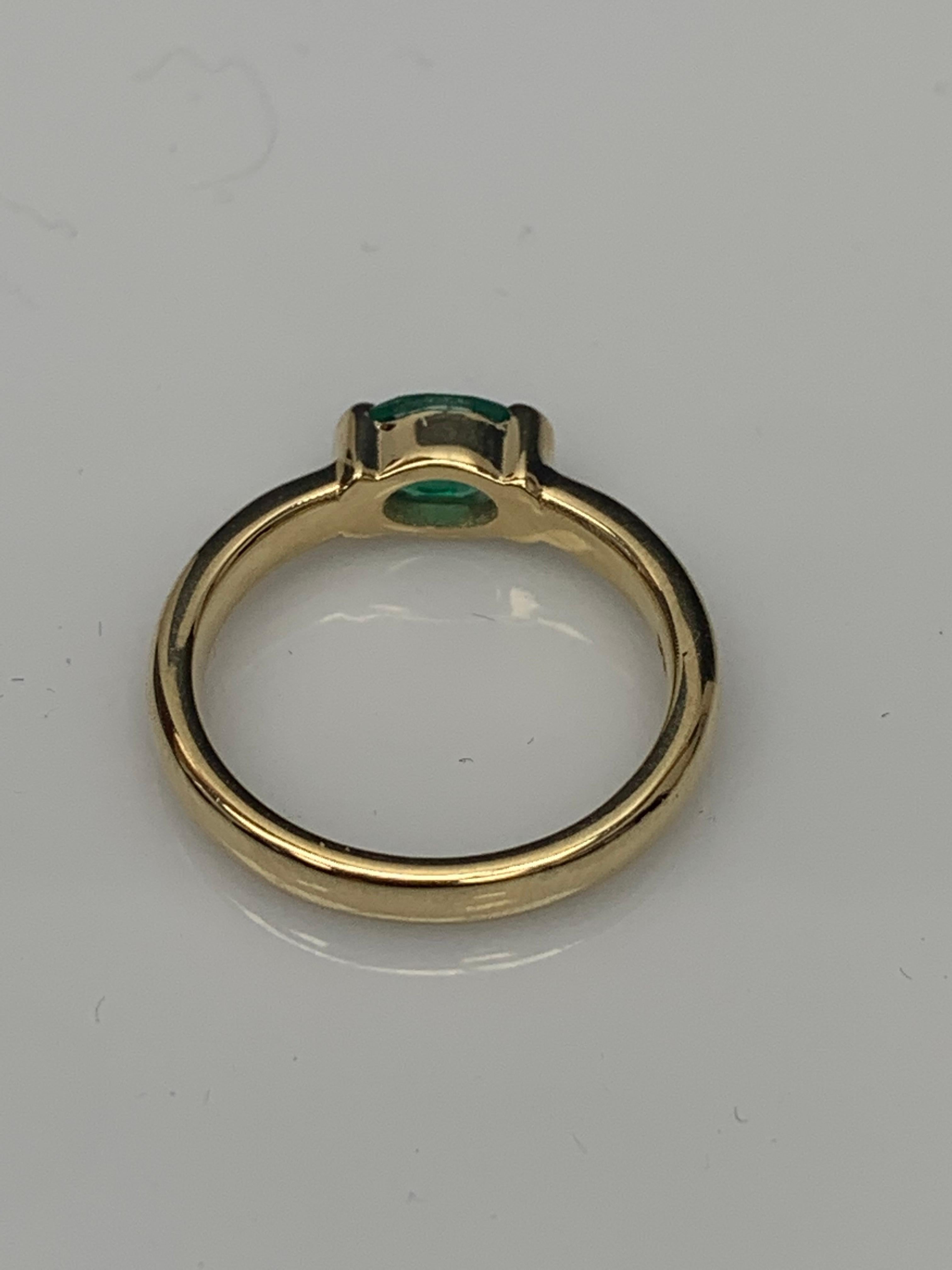 0.77 Carat Oval Cut Emerald Band Ring in 14K Yellow Gold For Sale 7