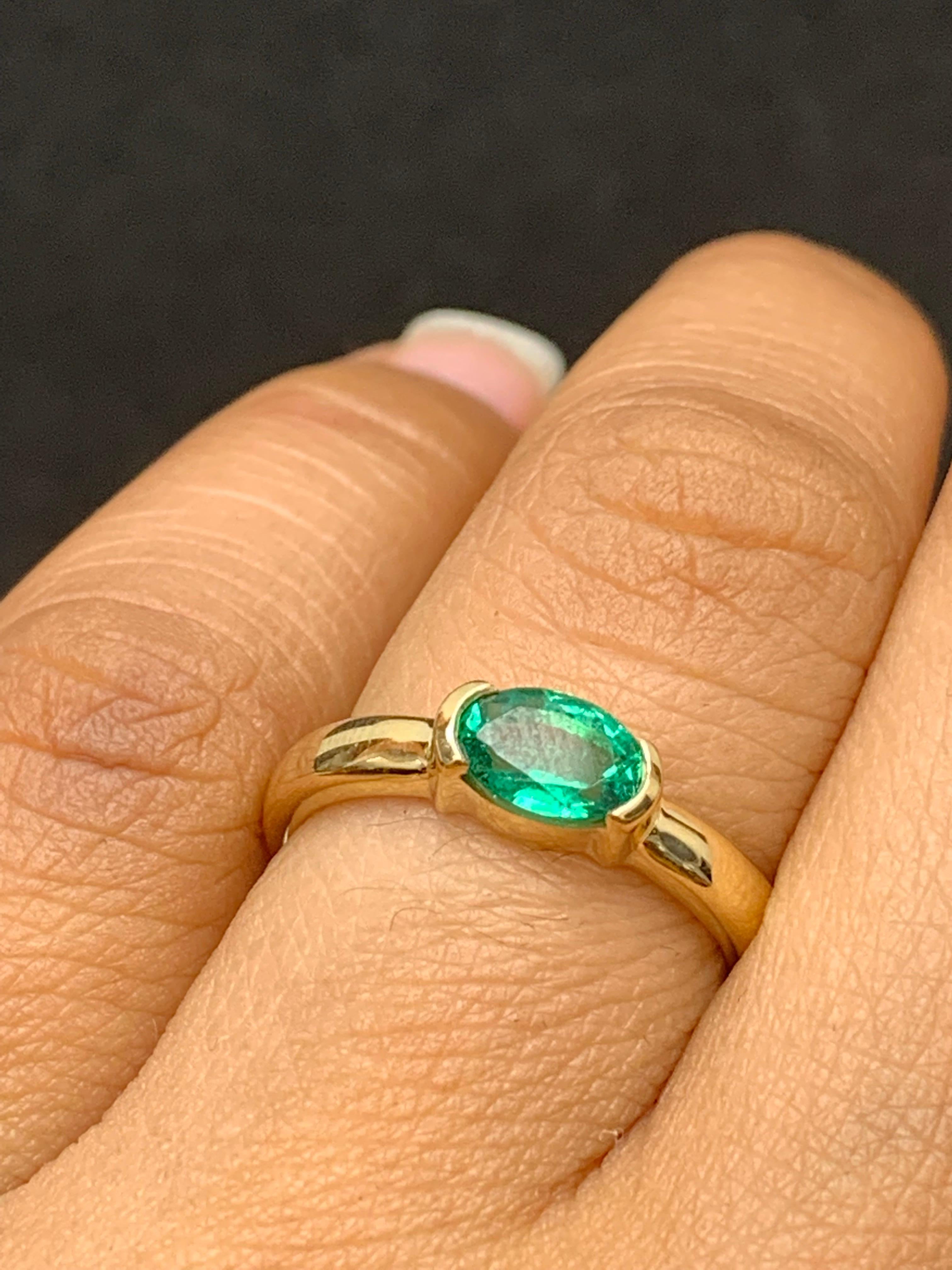 0.77 Carat Oval Cut Emerald Band Ring in 14K Yellow Gold For Sale 1