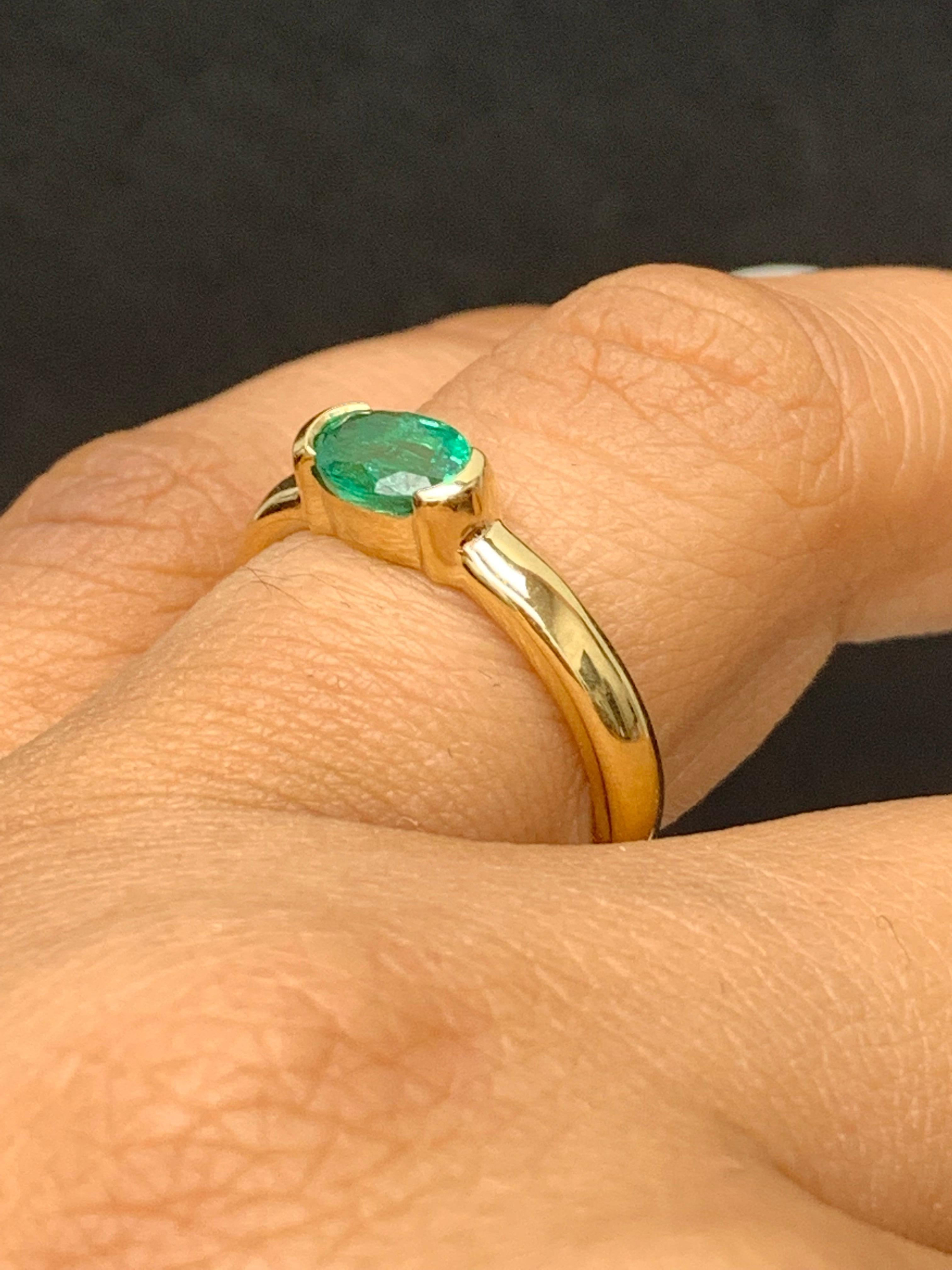 0.77 Carat Oval Cut Emerald Band Ring in 14K Yellow Gold For Sale 2