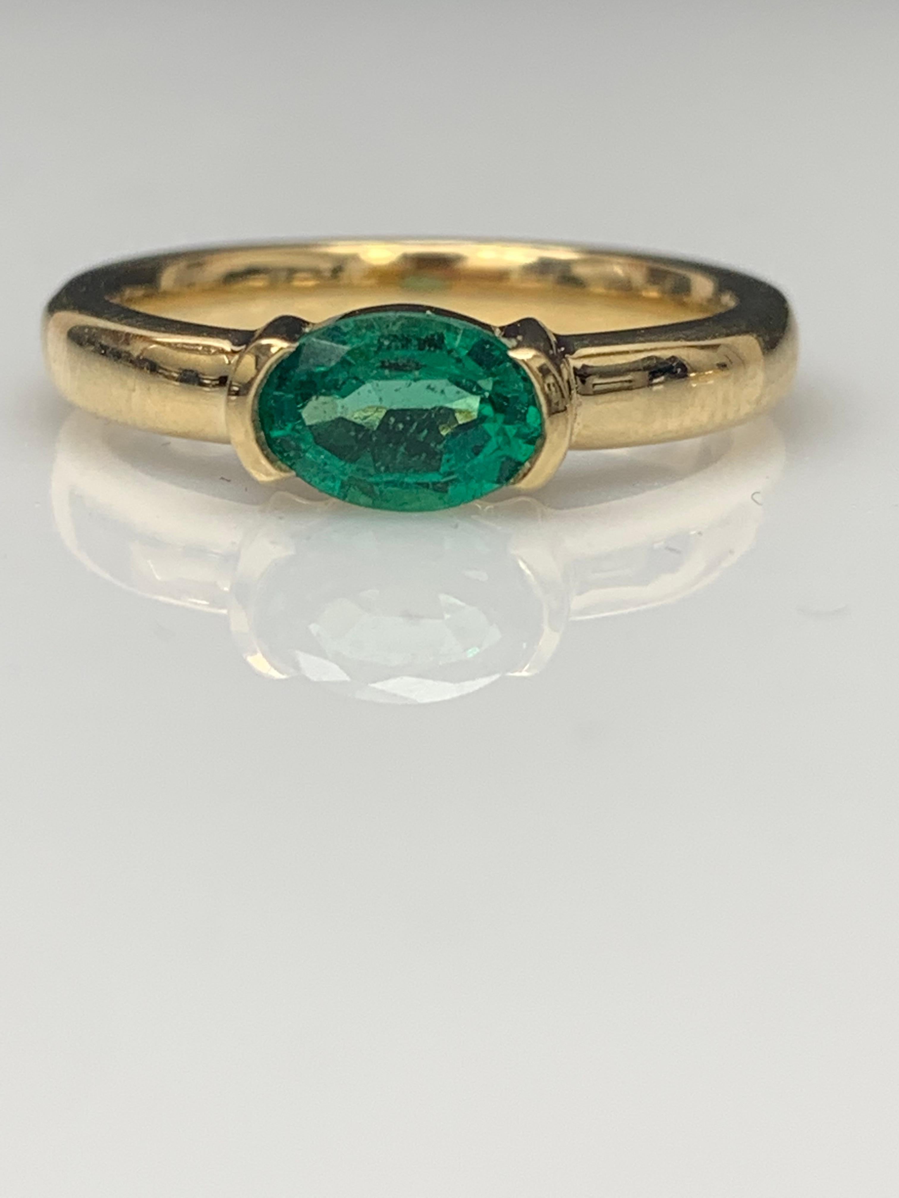 0.77 Carat Oval Cut Emerald Band Ring in 14K Yellow Gold For Sale 4