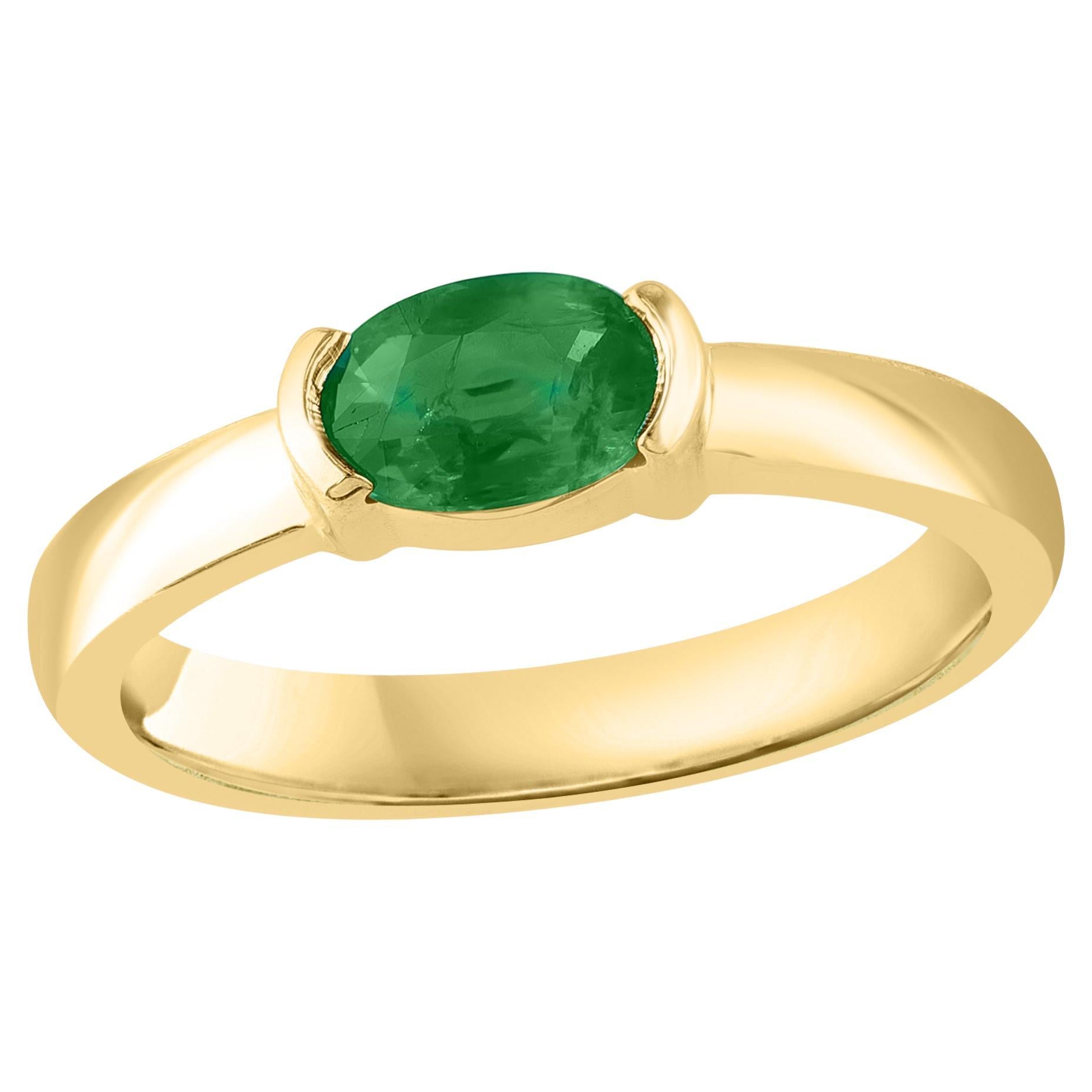0.77 Carat Oval Cut Emerald Band Ring in 14K Yellow Gold For Sale