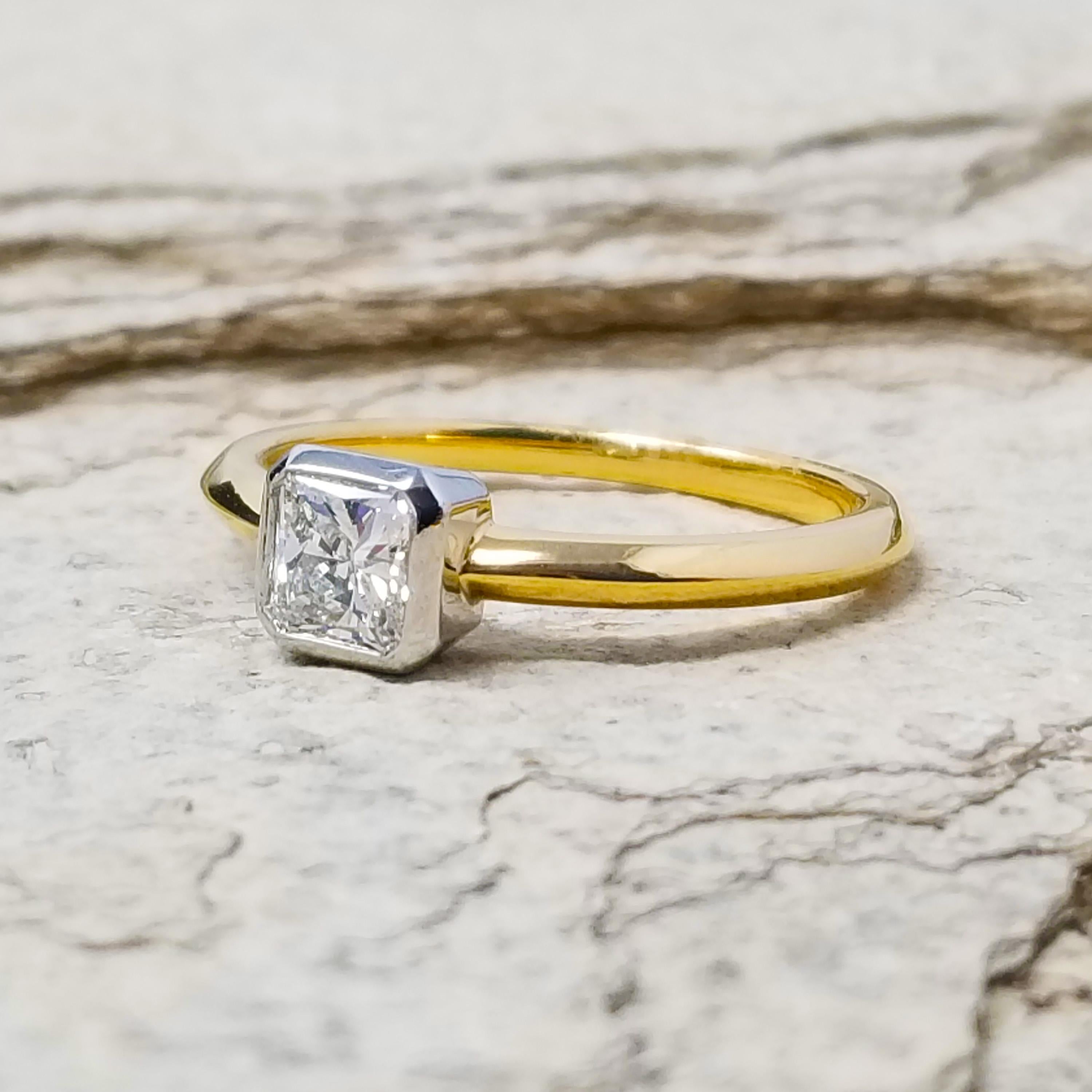 Elegant details, such as the knife edge band and the handmade platinum crown, set this 18kt diamond ring apart. The absolutely beautiful radiant cut diamond is cut for maximum sparkle, and this ring will absolutely dance on your finger. This can