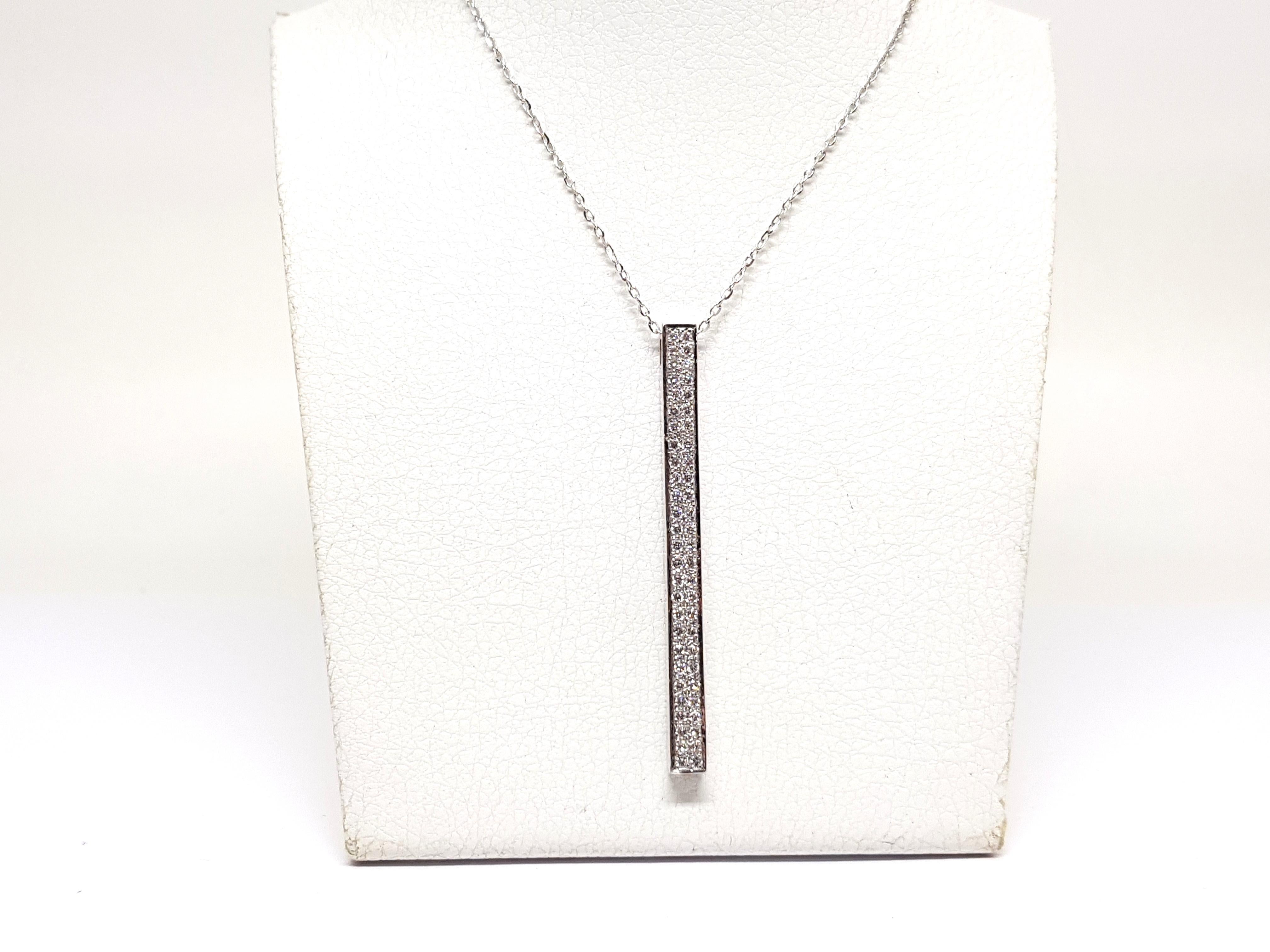Gold: 18K White gold 
Weight: 6.38 grams. 
Diamonds: 0.77ct. colour: G clarity: VS 
Length Pendant: 5.00 cm. 
Width Pendant: 0.40 cm. 
Length chain: choose between 40, 42, 45 or 50cm. 
All our jewellery comes with a certificate and a 5 year