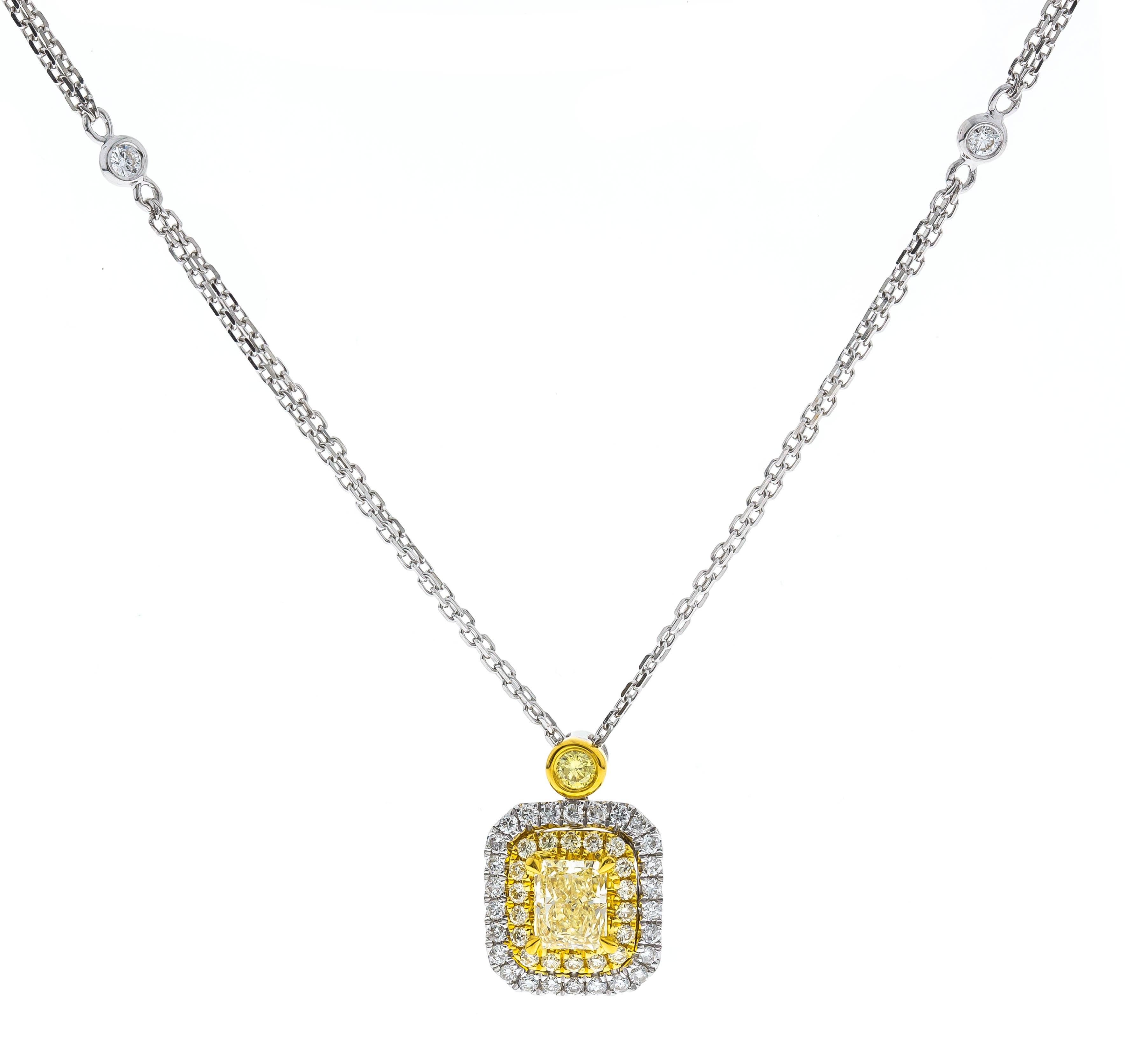 This beautiful Necklace is crafted in 18-karat Two Tone gold and features a cushion cut Yellow Diamond 0.77 Carat, SI Clarity and is surrounded by 19 Yellow Diamonds 0.17 Carat & 30 Round Diamonds 0.23 Carat. 
This Necklace is 18 inched in length