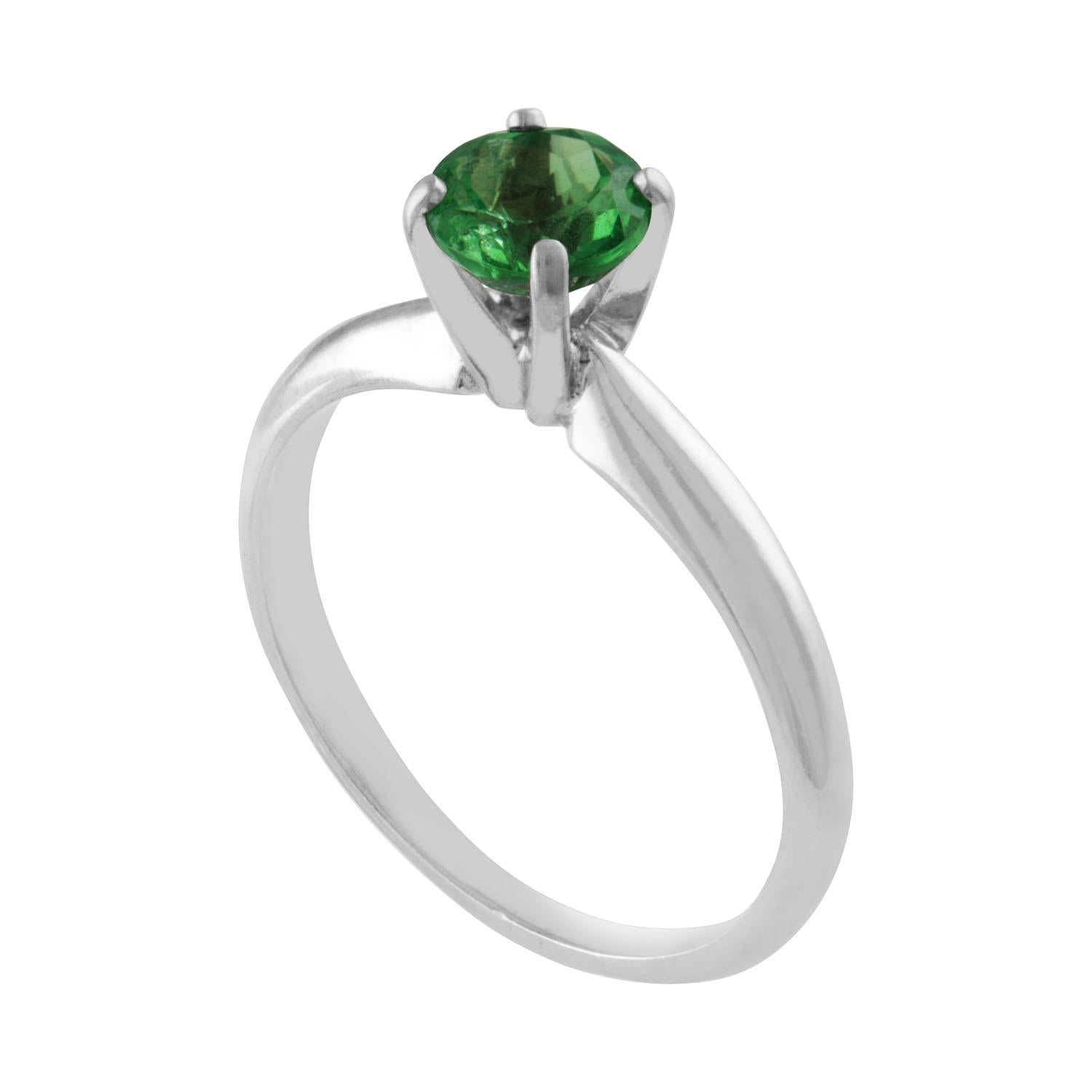 The ring is 14K White Gold
The Tsavorite is a round 0.77 Carat
The ring is a size 5.25, sizable.
The ring weighs 2.0 grams