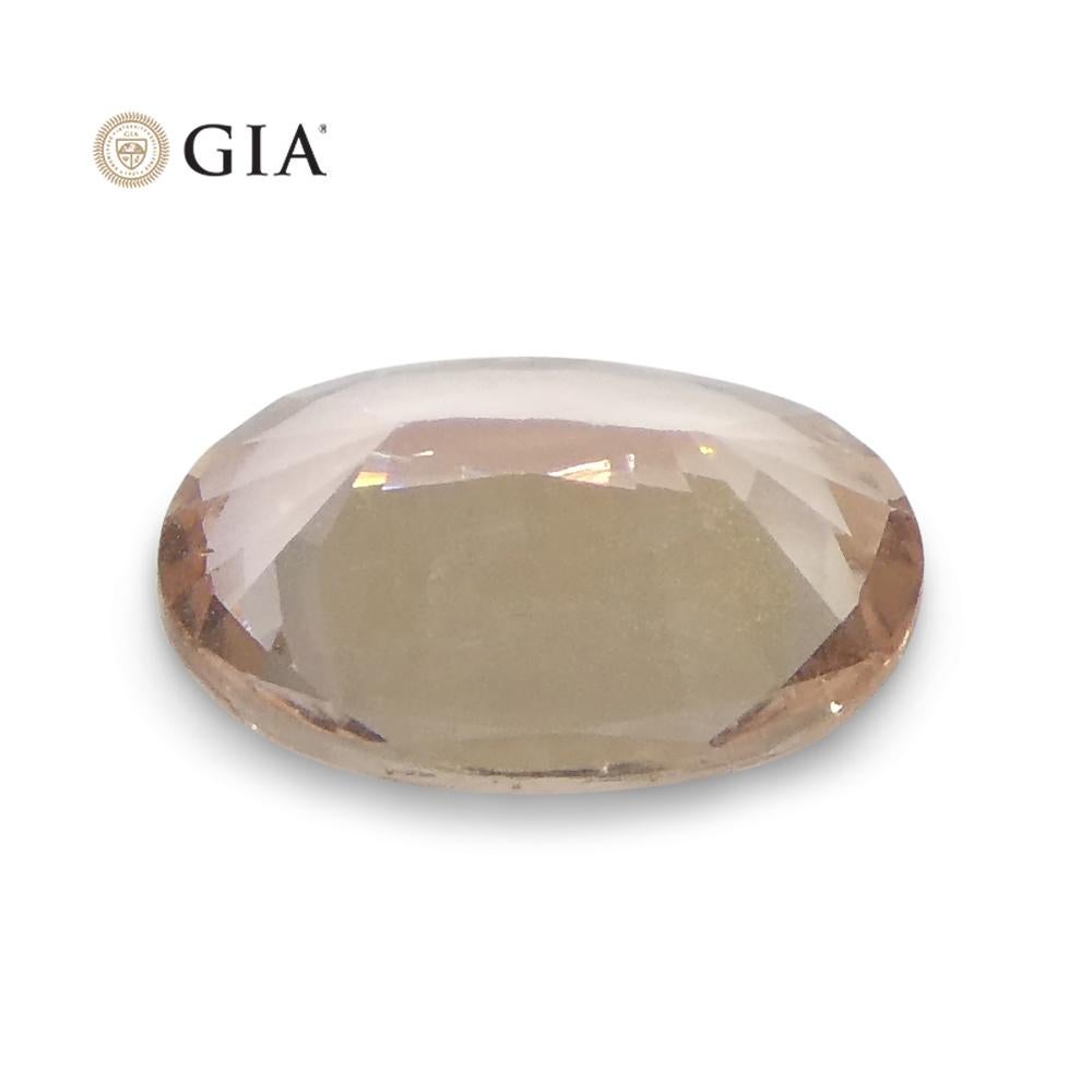 0.77 Carat Oval Orangy Pink Padparadscha Sapphire GIA Certified East Africa For Sale 7