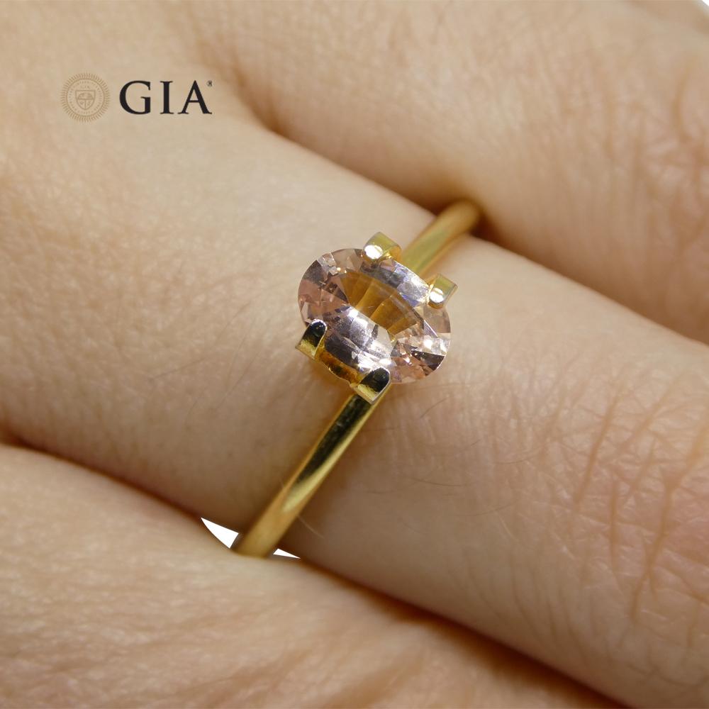 Brilliant Cut 0.77 Carat Oval Orangy Pink Padparadscha Sapphire GIA Certified East Africa For Sale